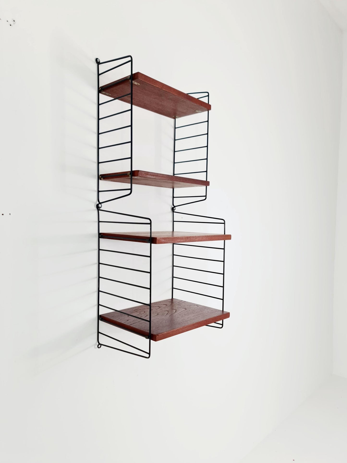 Original MCM Teak shelving system - consists of Black lacquered metal ladders, from string Stockholm 1960s