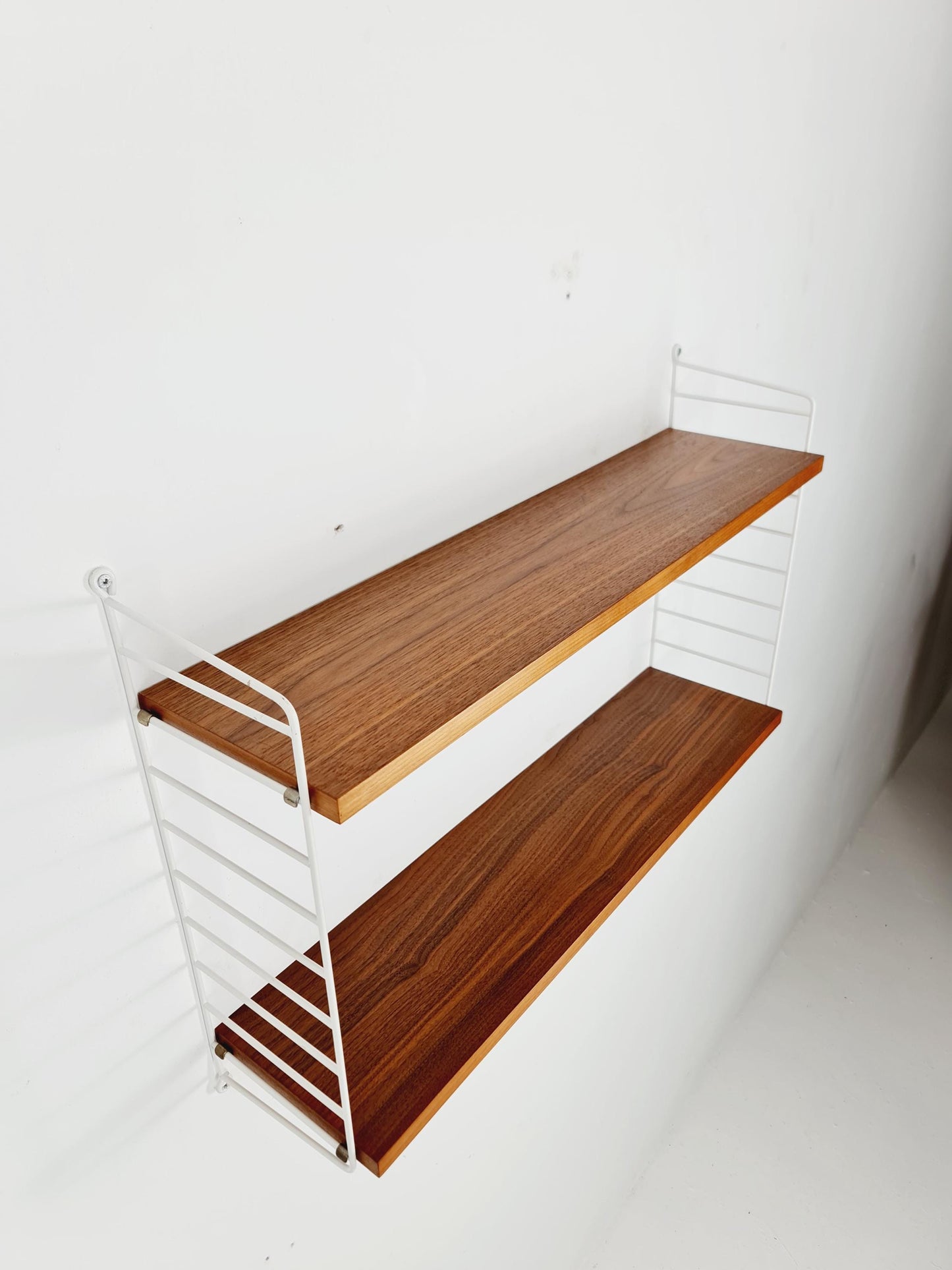 Original MCM Teak shelving system - consists of White lacquered metal ladders, from string Stockholm 1960s