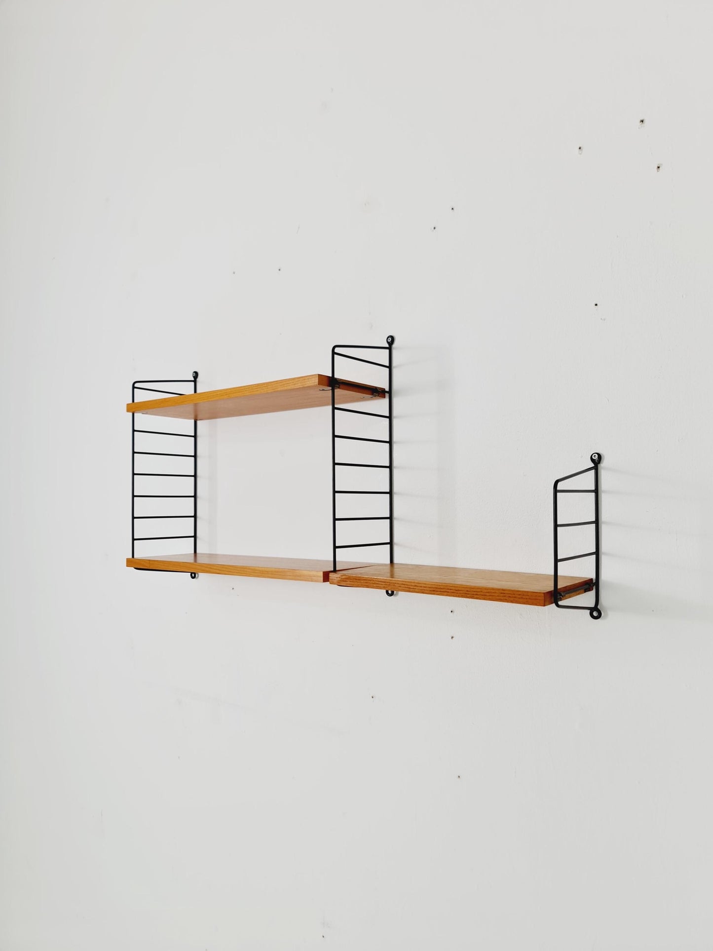 Original MCM Ash shelving system - consists of Black lacquered metal ladders, from string Stockholm 1960s