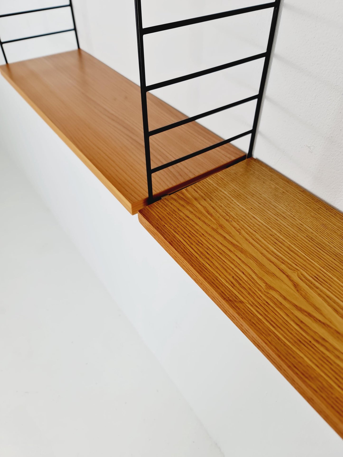 Original MCM Ash shelving system - consists of Black lacquered metal ladders, from string Stockholm 1960s