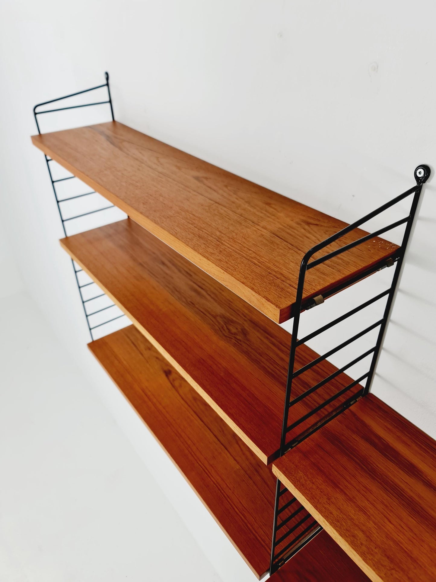 Original MCM Teak shelving system - consists of Black lacquered metal ladders, from string Stockholm 1960s