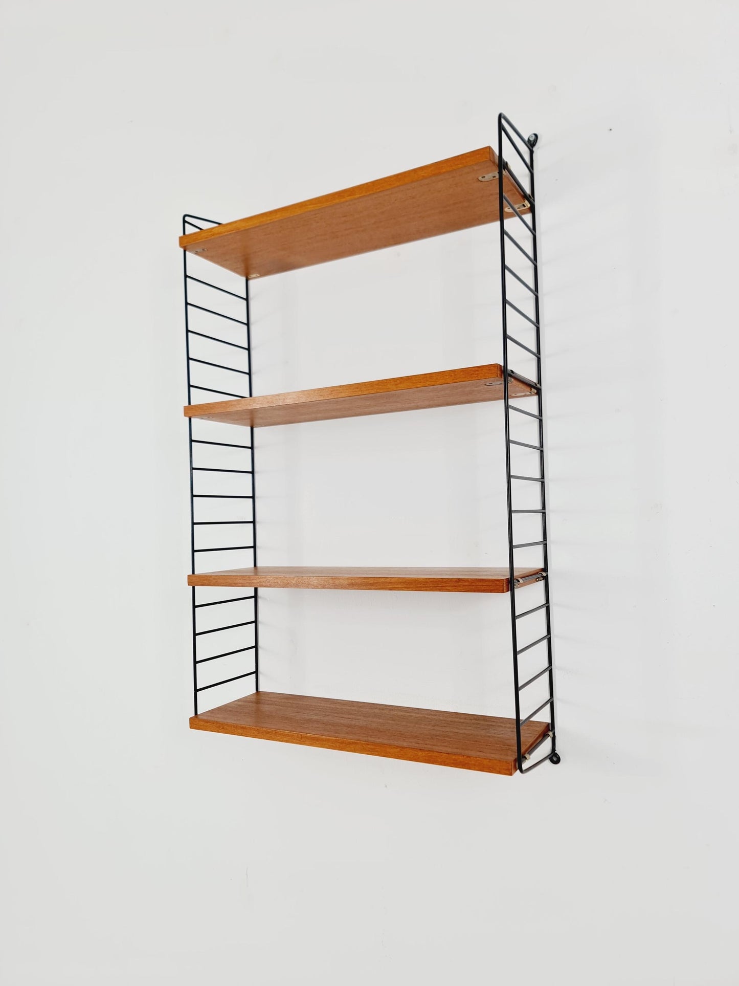 Original MCM Teak shelving system - consists of Black lacquered metal ladders, from string Stockholm 1960s
