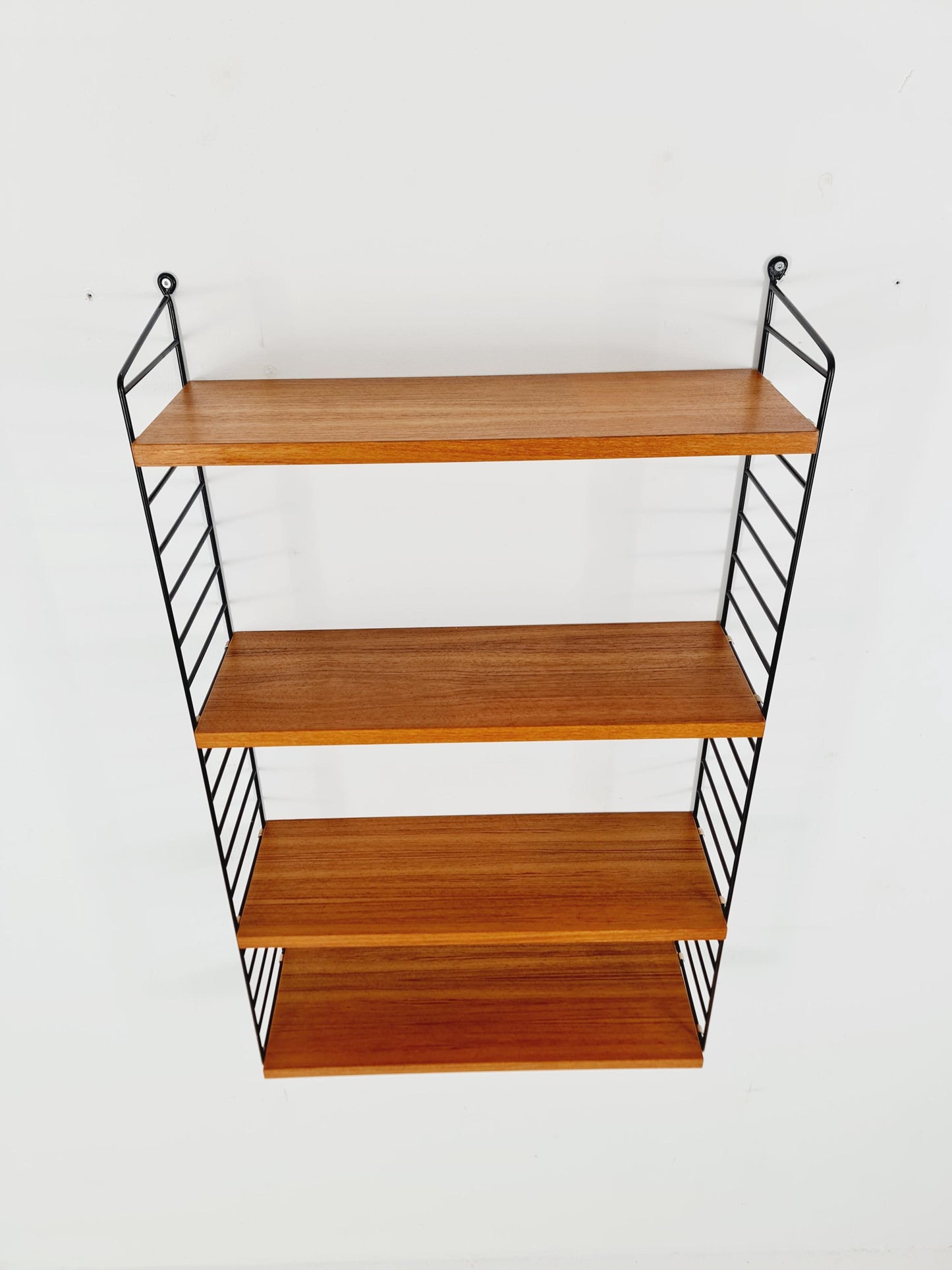 Original MCM Teak shelving system - consists of Black lacquered metal ladders, from string Stockholm 1960s