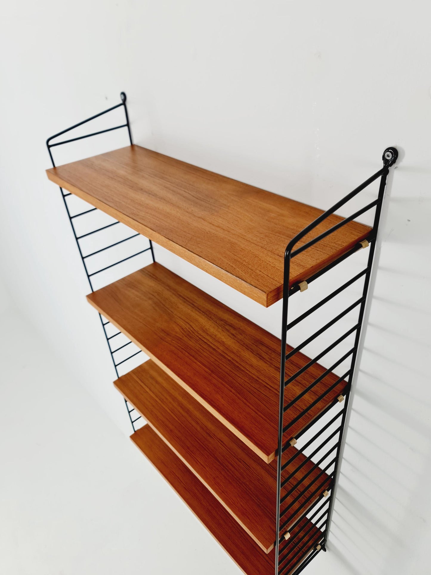 Original MCM Teak shelving system - consists of Black lacquered metal ladders, from string Stockholm 1960s