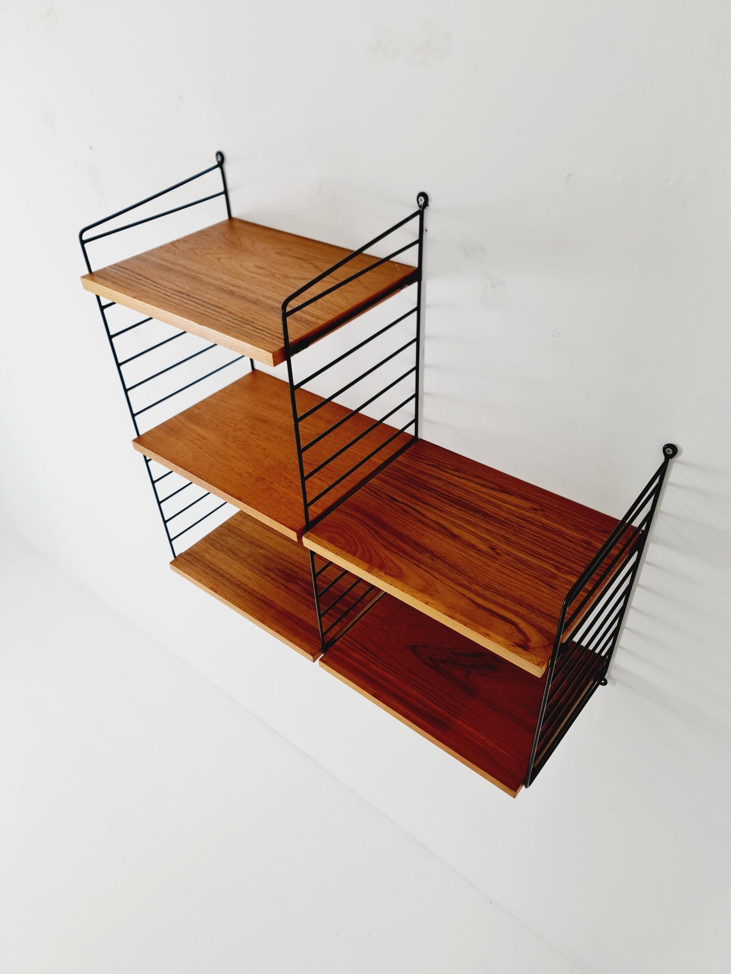 Original MCM Teak shelving system - consists of Black lacquered metal ladders, from string Stockholm 1960s
