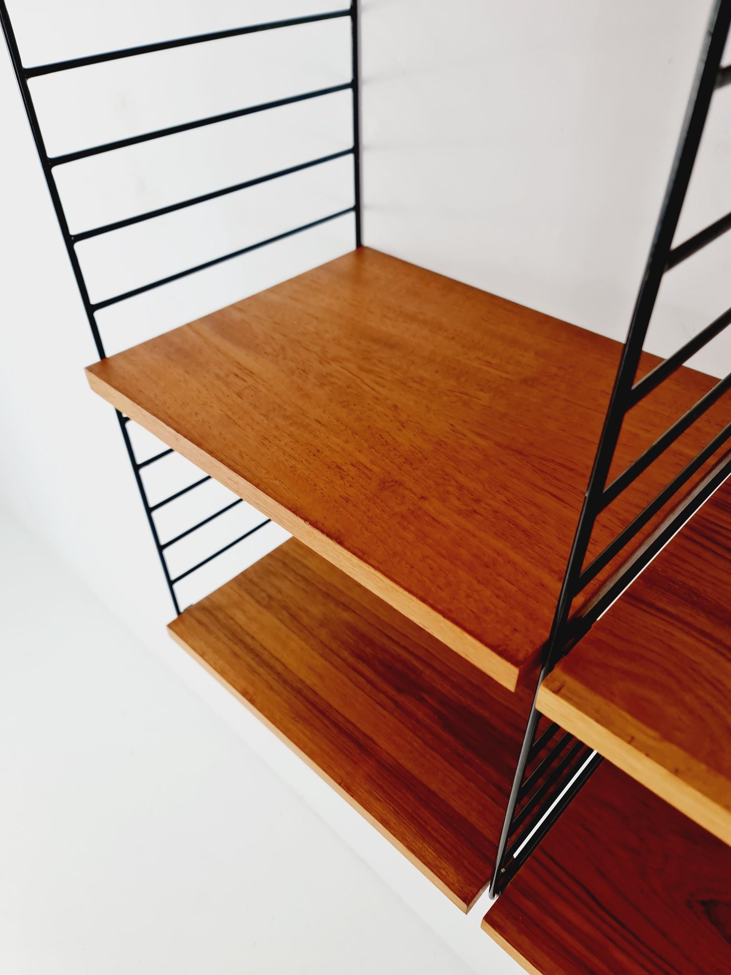 Original MCM Teak shelving system - consists of Black lacquered metal ladders, from string Stockholm 1960s