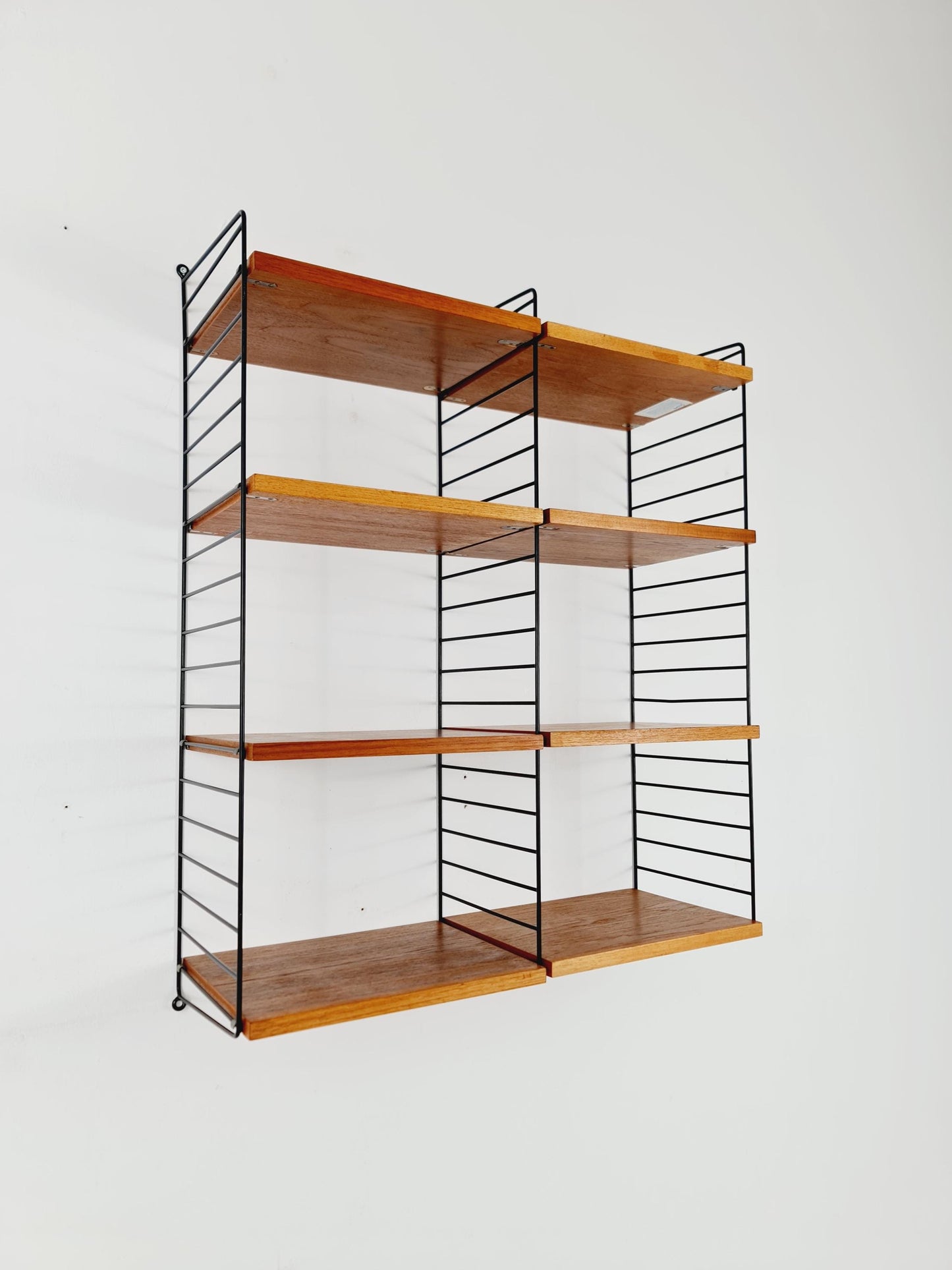 Original MCM Teak shelving system - consists of Black lacquered metal ladders, from string Stockholm 1960s