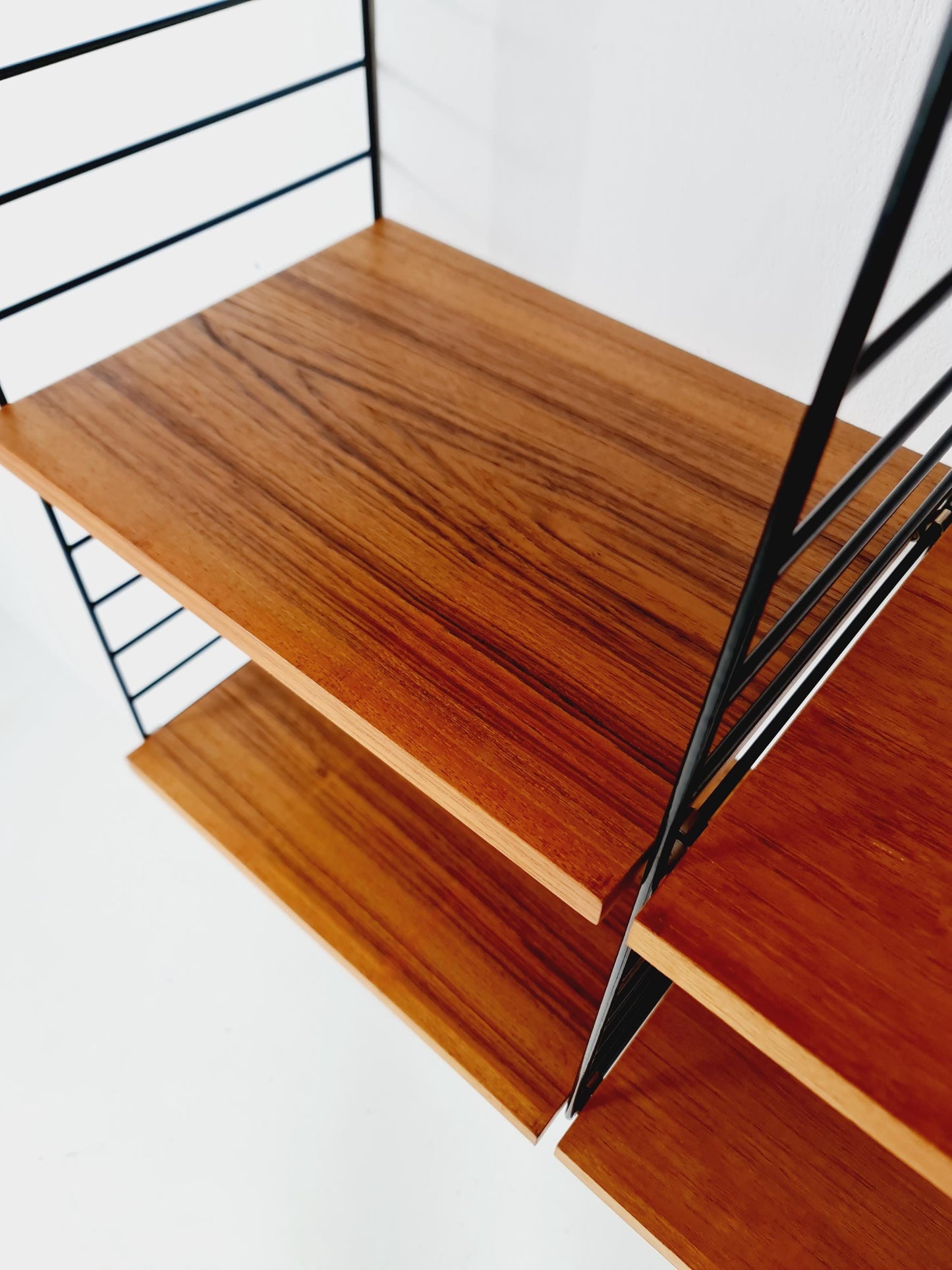 Original MCM Teak shelving system - consists of Black lacquered metal ladders, from string Stockholm 1960s