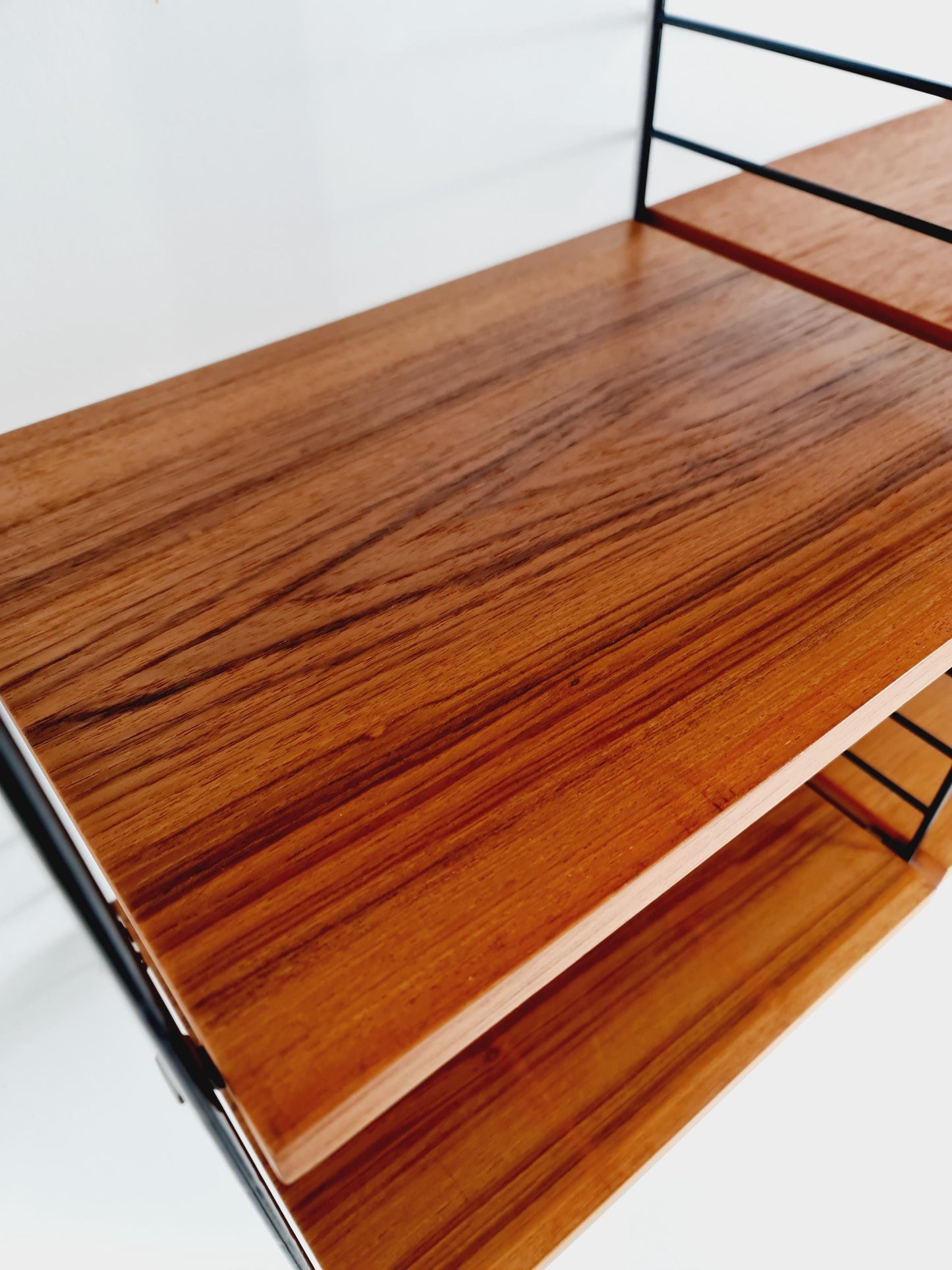 Original MCM Teak shelving system - consists of Black lacquered metal ladders, from string Stockholm 1960s