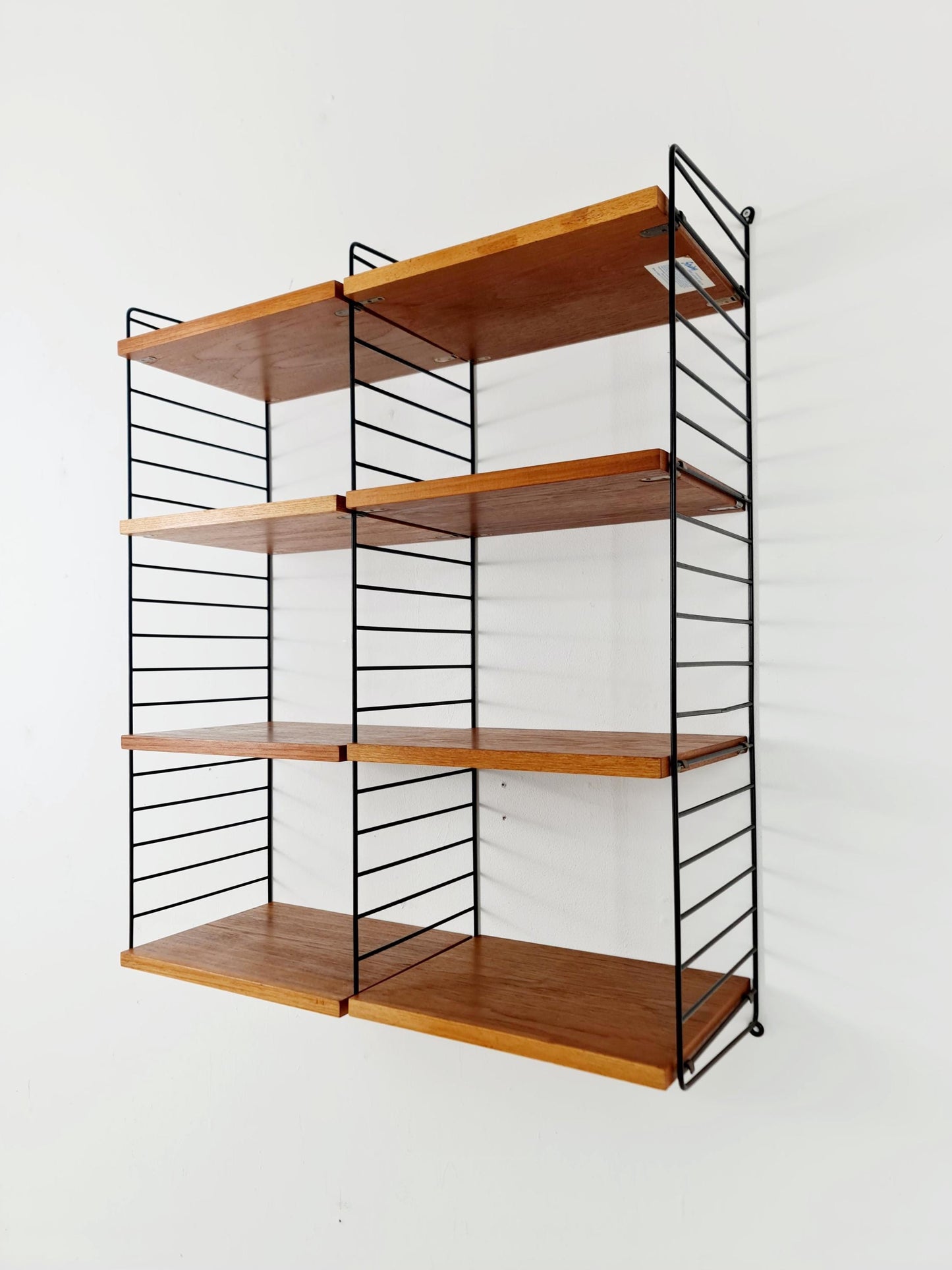 Original MCM Teak shelving system - consists of Black lacquered metal ladders, from string Stockholm 1960s