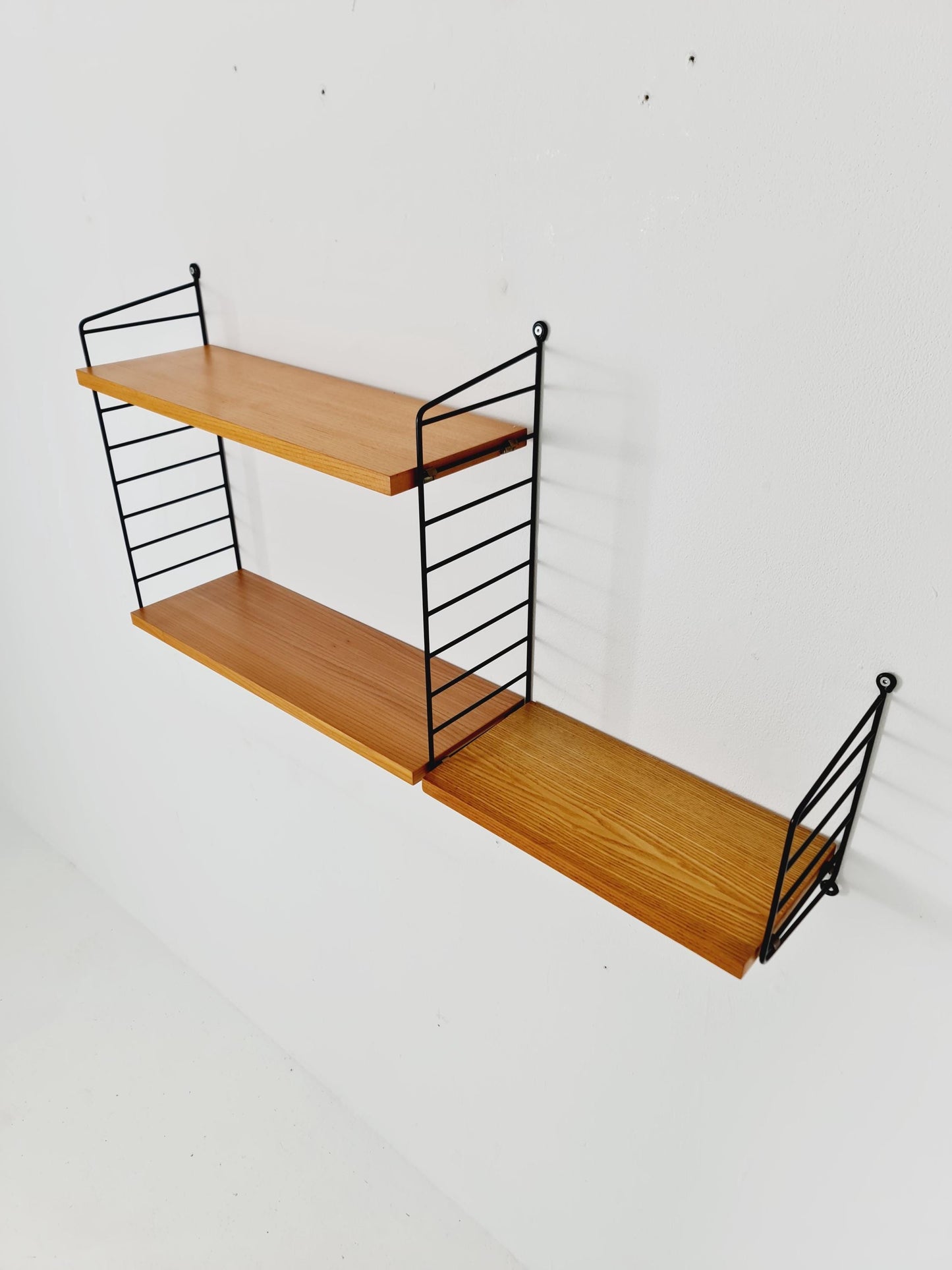 Original MCM Ash shelving system - consists of Black lacquered metal ladders, from string Stockholm 1960s