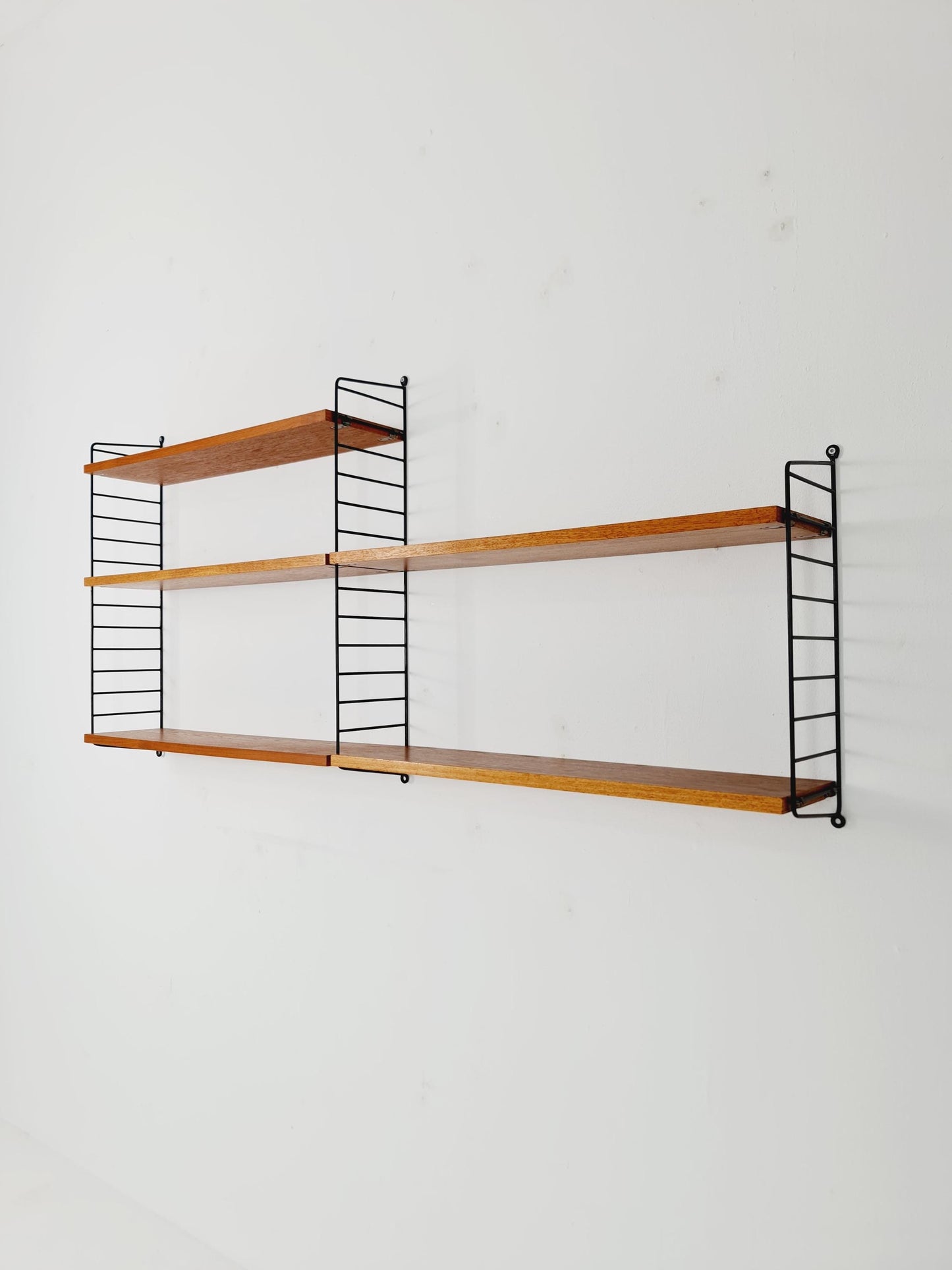 Original MCM Teak shelving system - consists of Black lacquered metal ladders, from string Stockholm 1960s