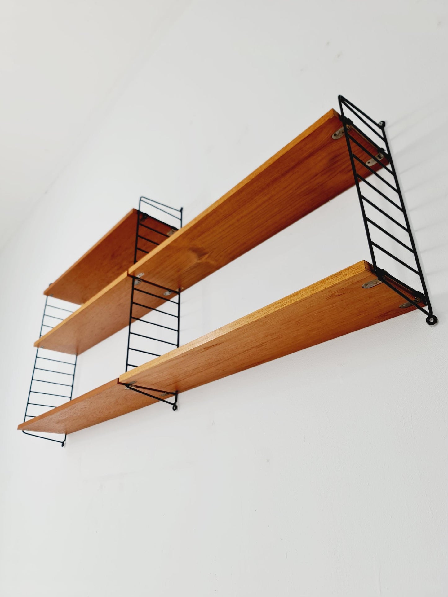 Original MCM Teak shelving system - consists of Black lacquered metal ladders, from string Stockholm 1960s