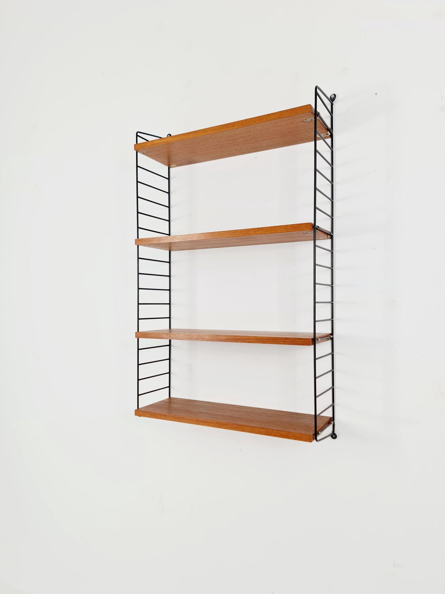 Original MCM Teak shelving system - consists of Black lacquered metal ladders, from string Stockholm 1960s