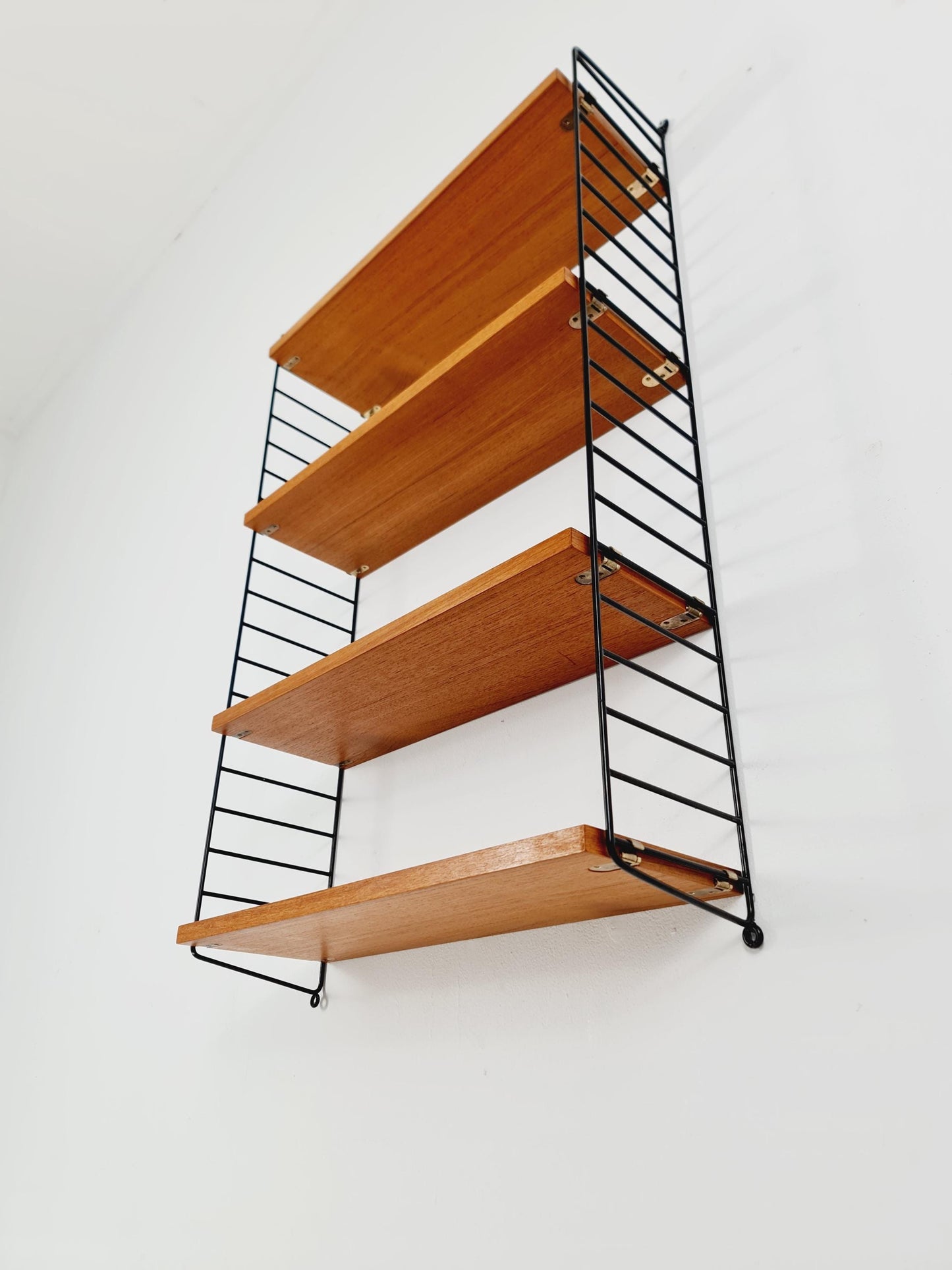 Original MCM Teak shelving system - consists of Black lacquered metal ladders, from string Stockholm 1960s