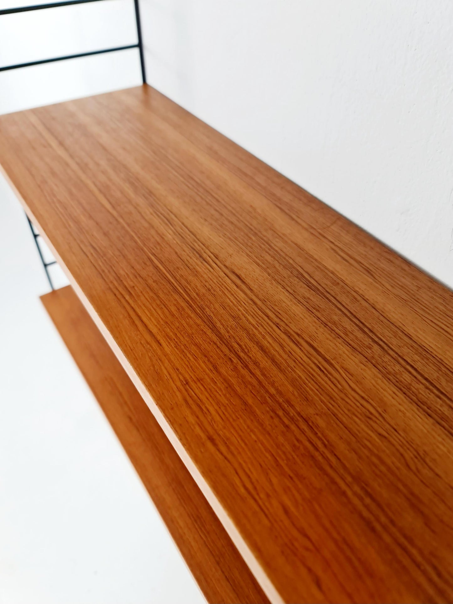 Original MCM Teak shelving system - consists of Black lacquered metal ladders, from string Stockholm 1960s