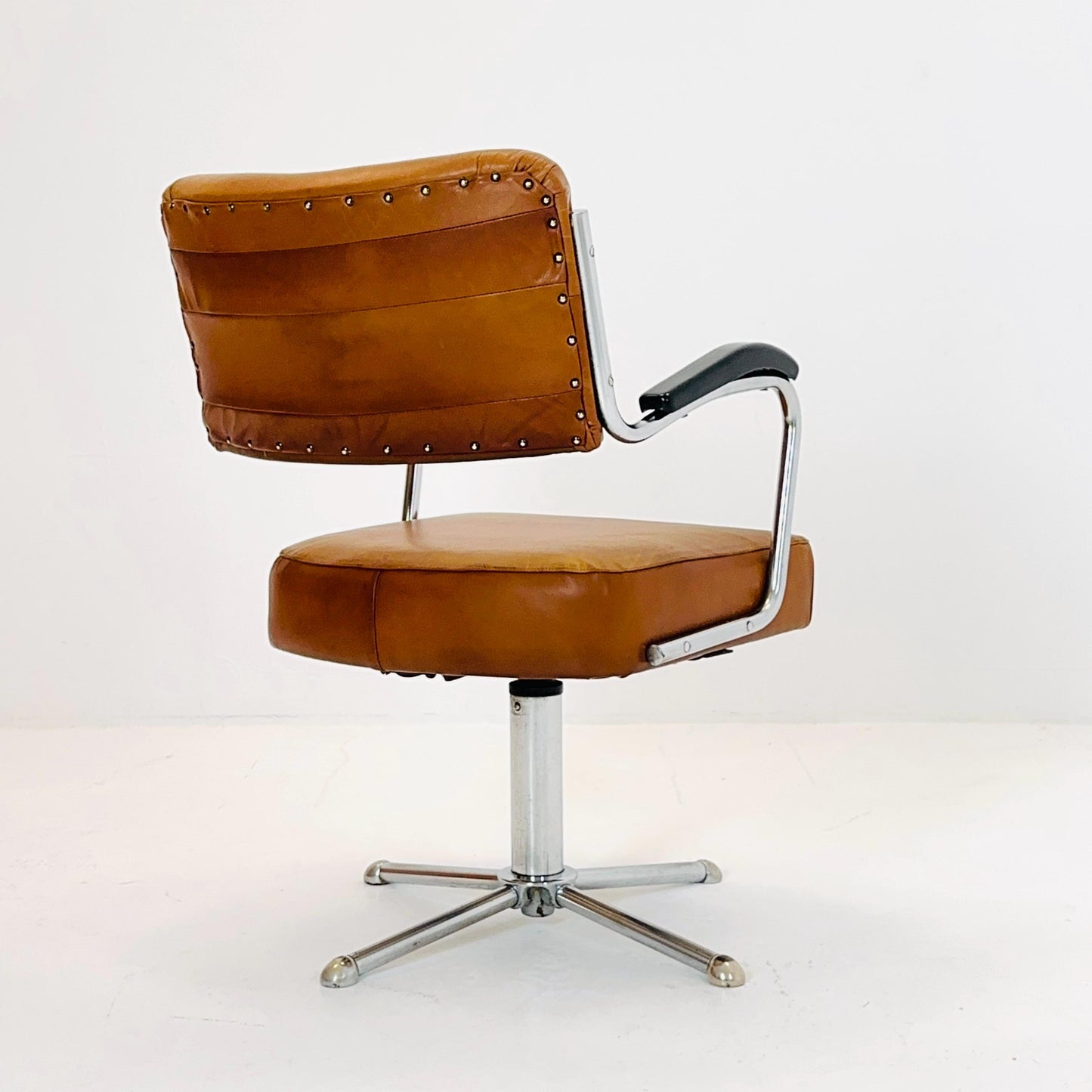 Mid century cognac leather swivel desk armchair 1980s Germany