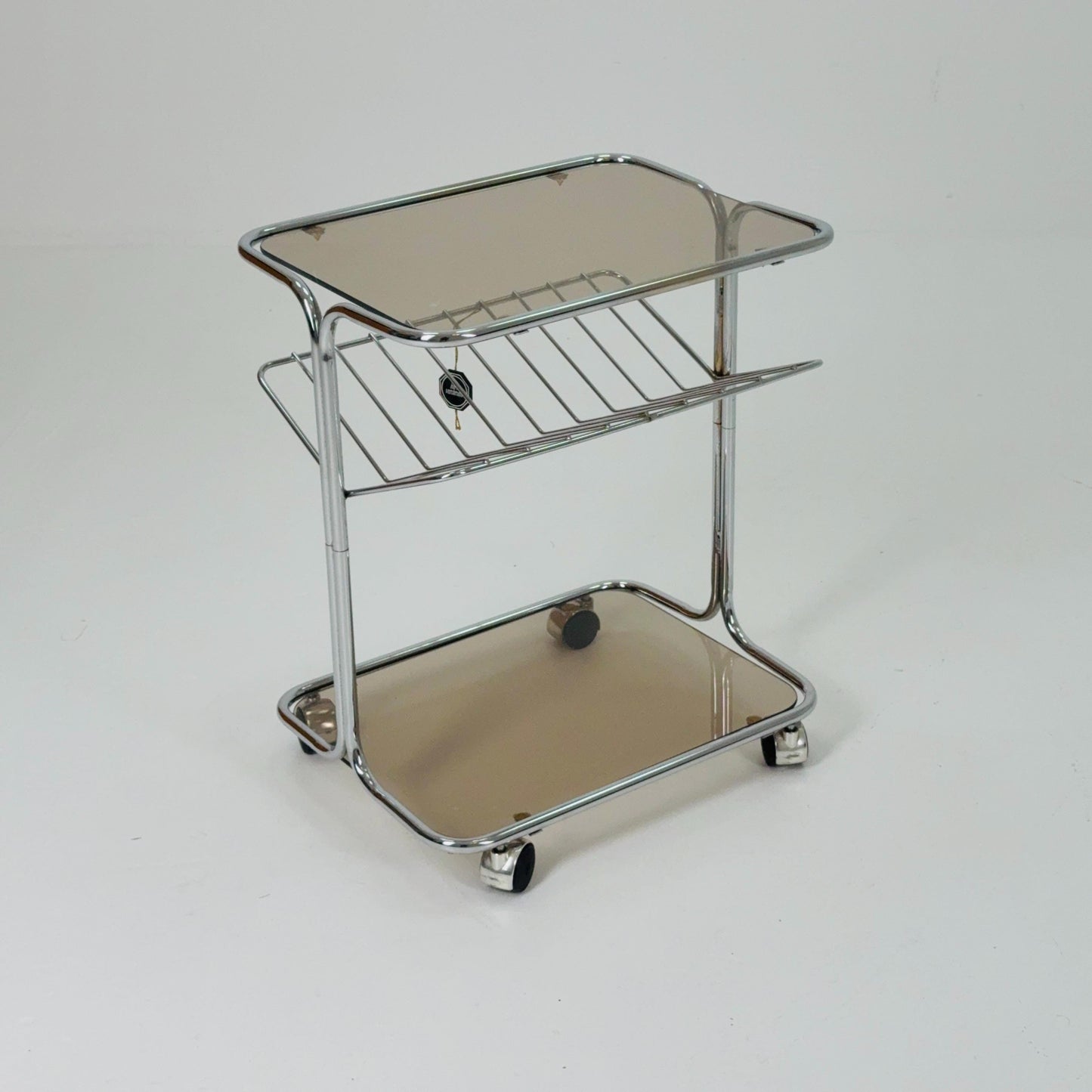 Mid century Chrome bar cart/serving trolley. magazine rack Smoked glass ,Bauhaus Germany 1980s