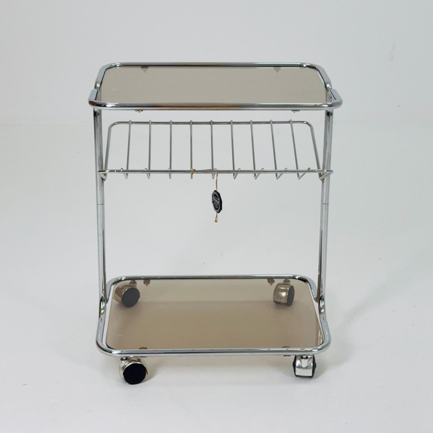 Mid century Chrome bar cart/serving trolley. magazine rack Smoked glass ,Bauhaus Germany 1980s