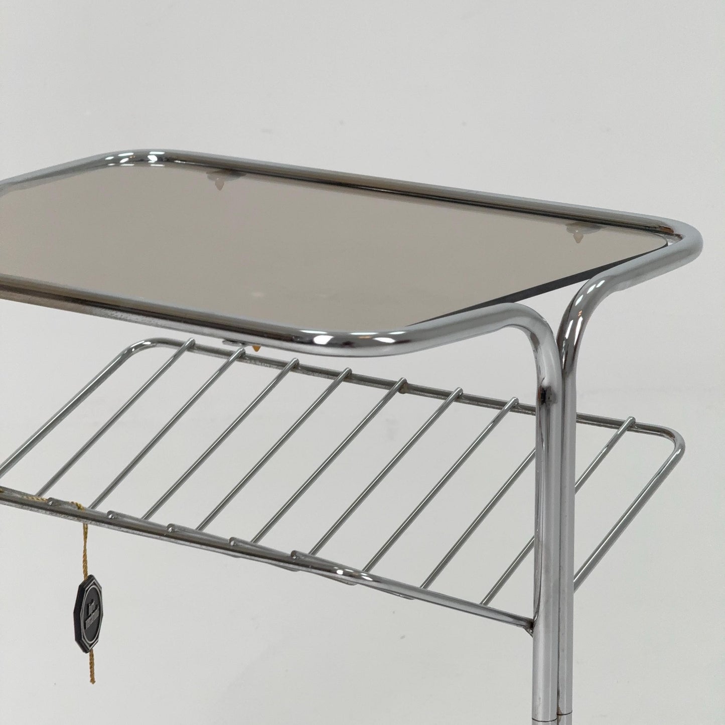 Mid century Chrome bar cart/serving trolley. magazine rack Smoked glass ,Bauhaus Germany 1980s