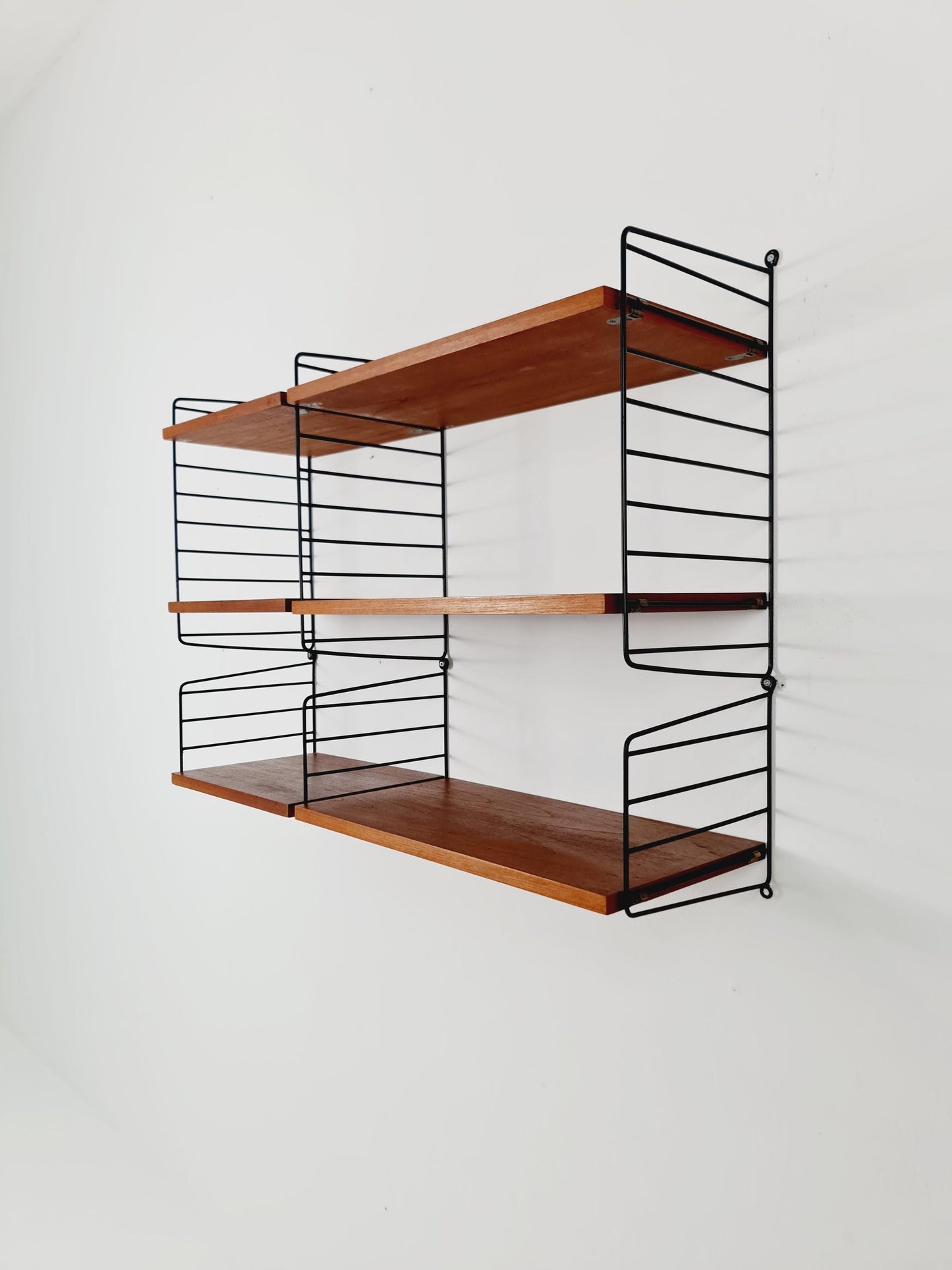 Original MCM Teak shelving system - consists of Black lacquered metal ladders, from string Stockholm 1960s