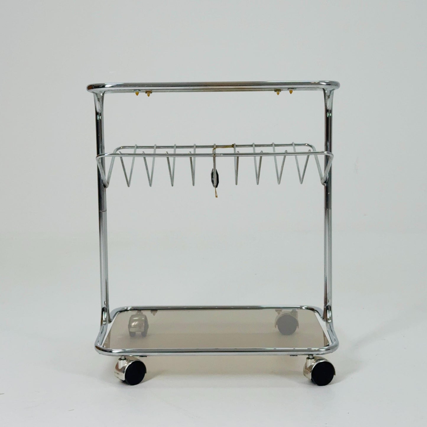 Mid century Chrome bar cart/serving trolley. magazine rack Smoked glass ,Bauhaus Germany 1980s