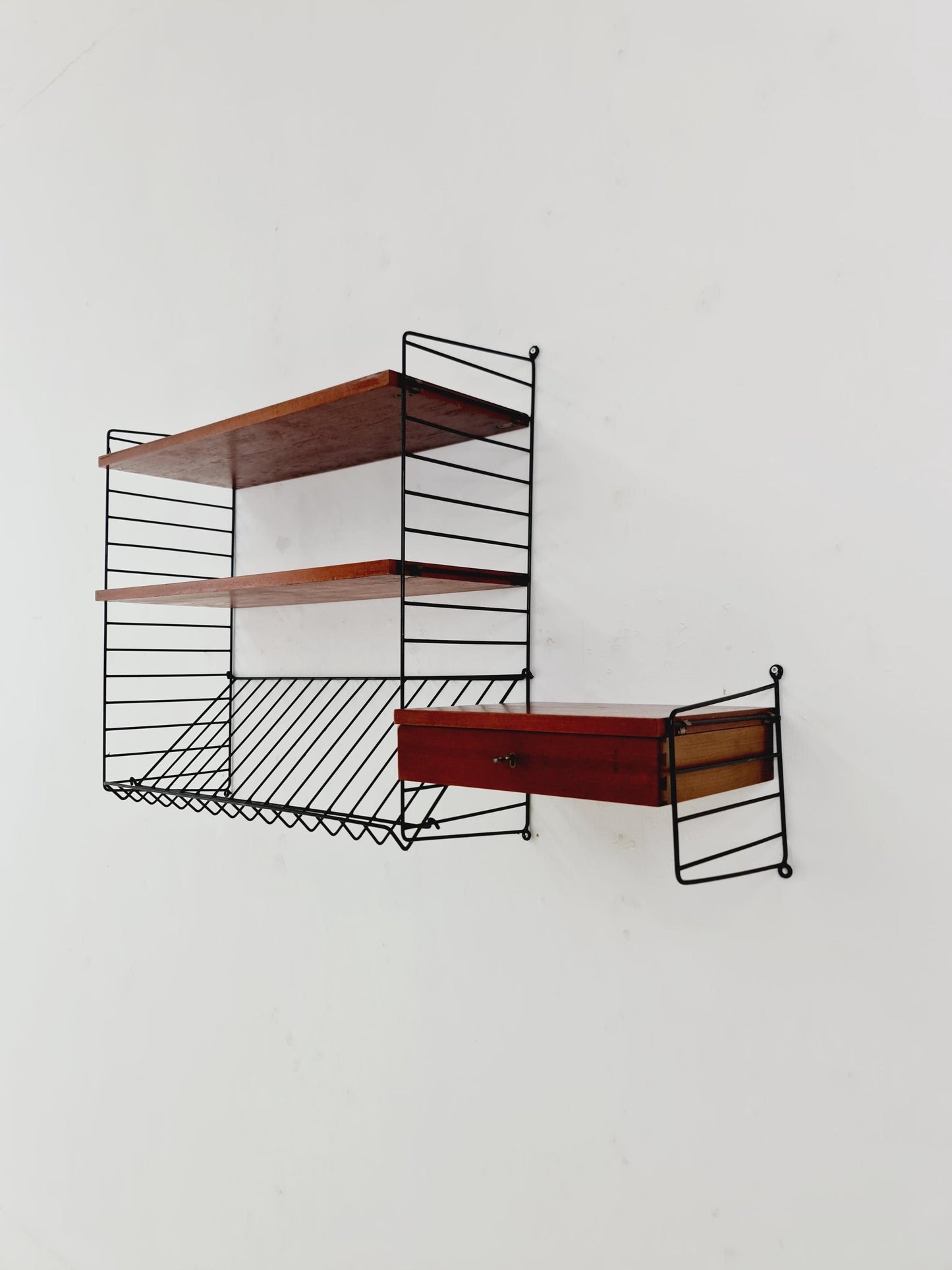 Original MCM Teak shelving system - consists of black lacquered metal ladders, from string Stockholm 1960s