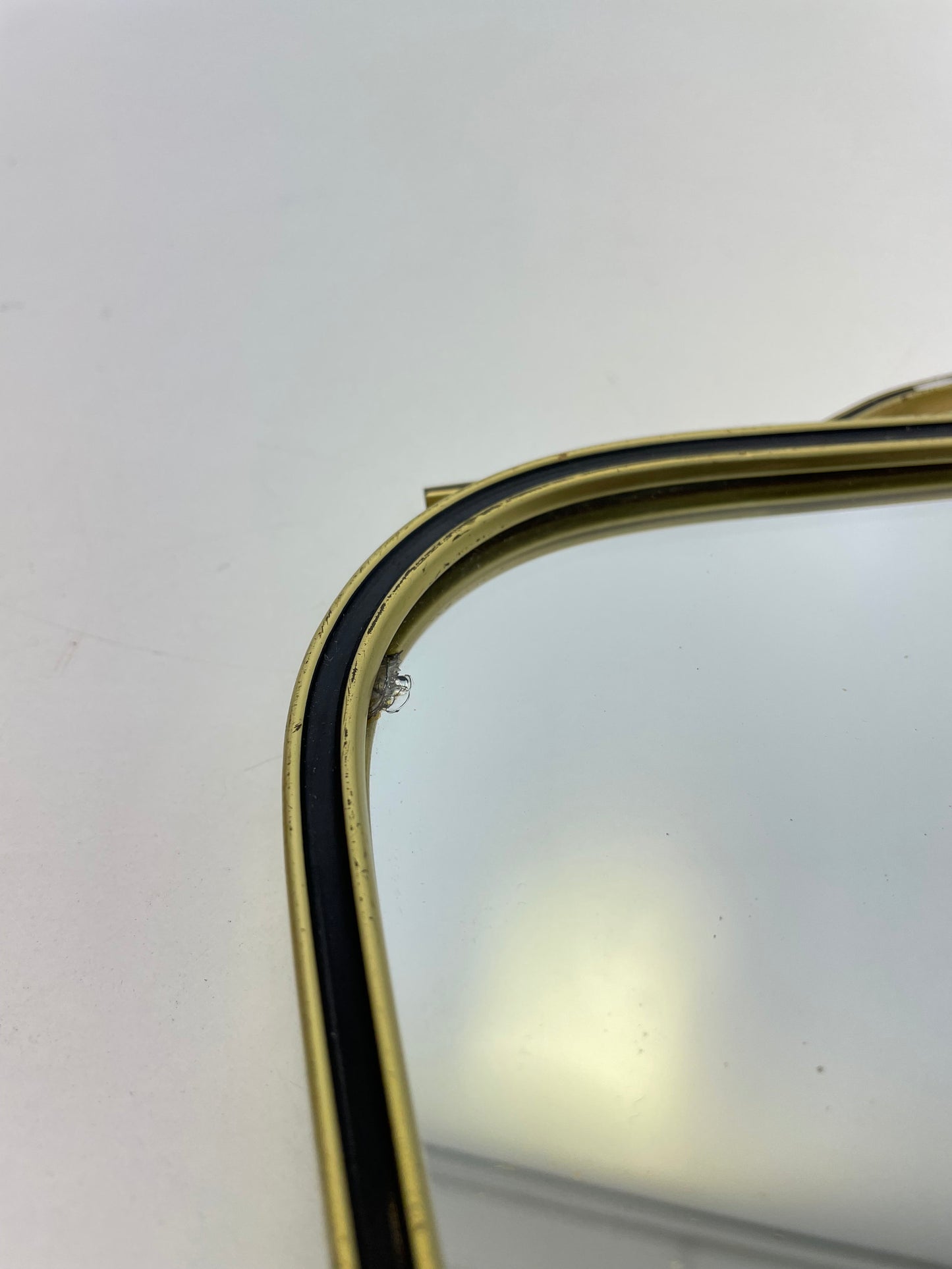 Mid Century asymmetric German brass Original kidney wall mirror with 2 brass hangers, 1960s