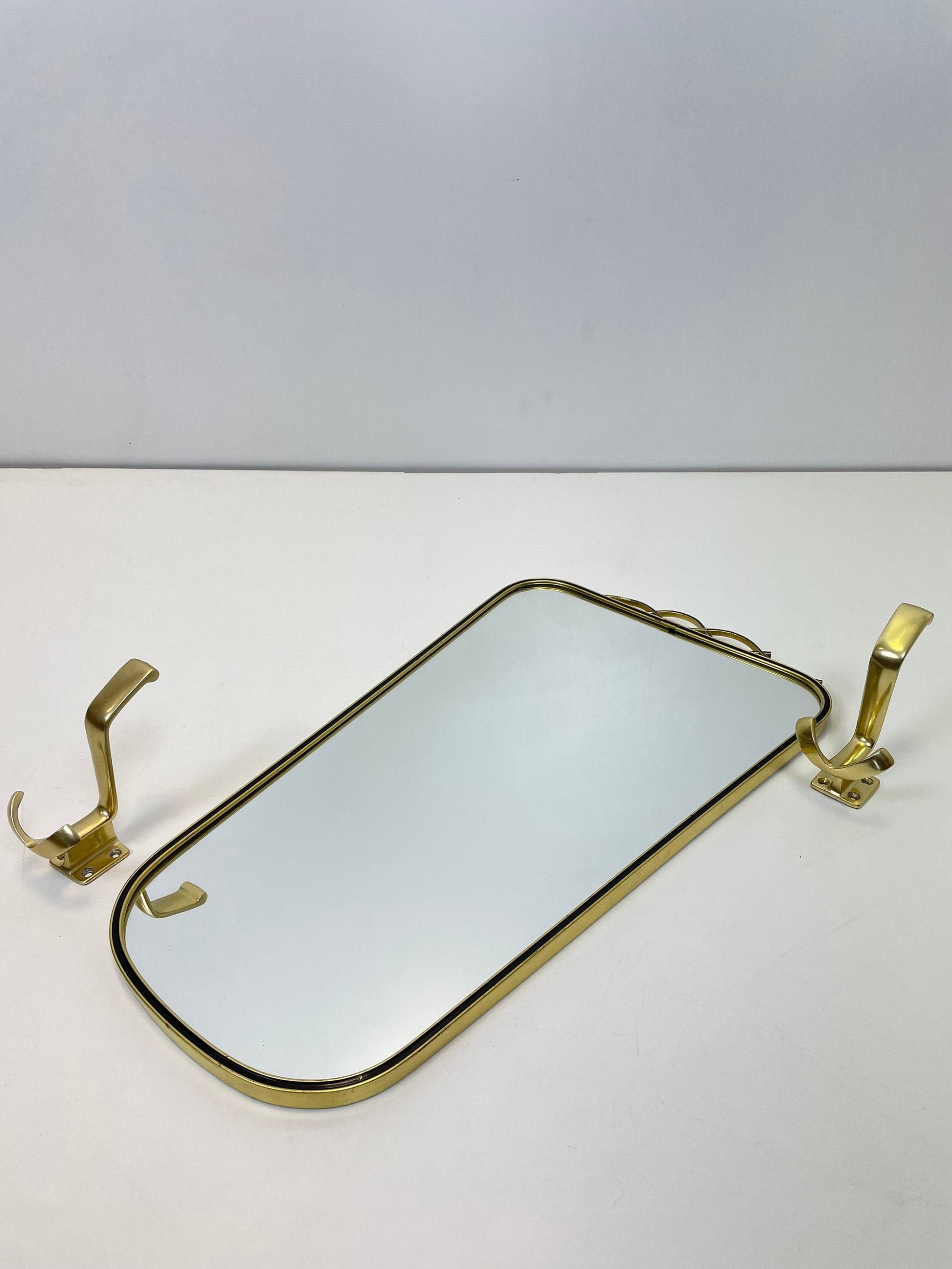 Mid Century asymmetric German brass Original kidney wall mirror with 2 brass hangers, 1960s