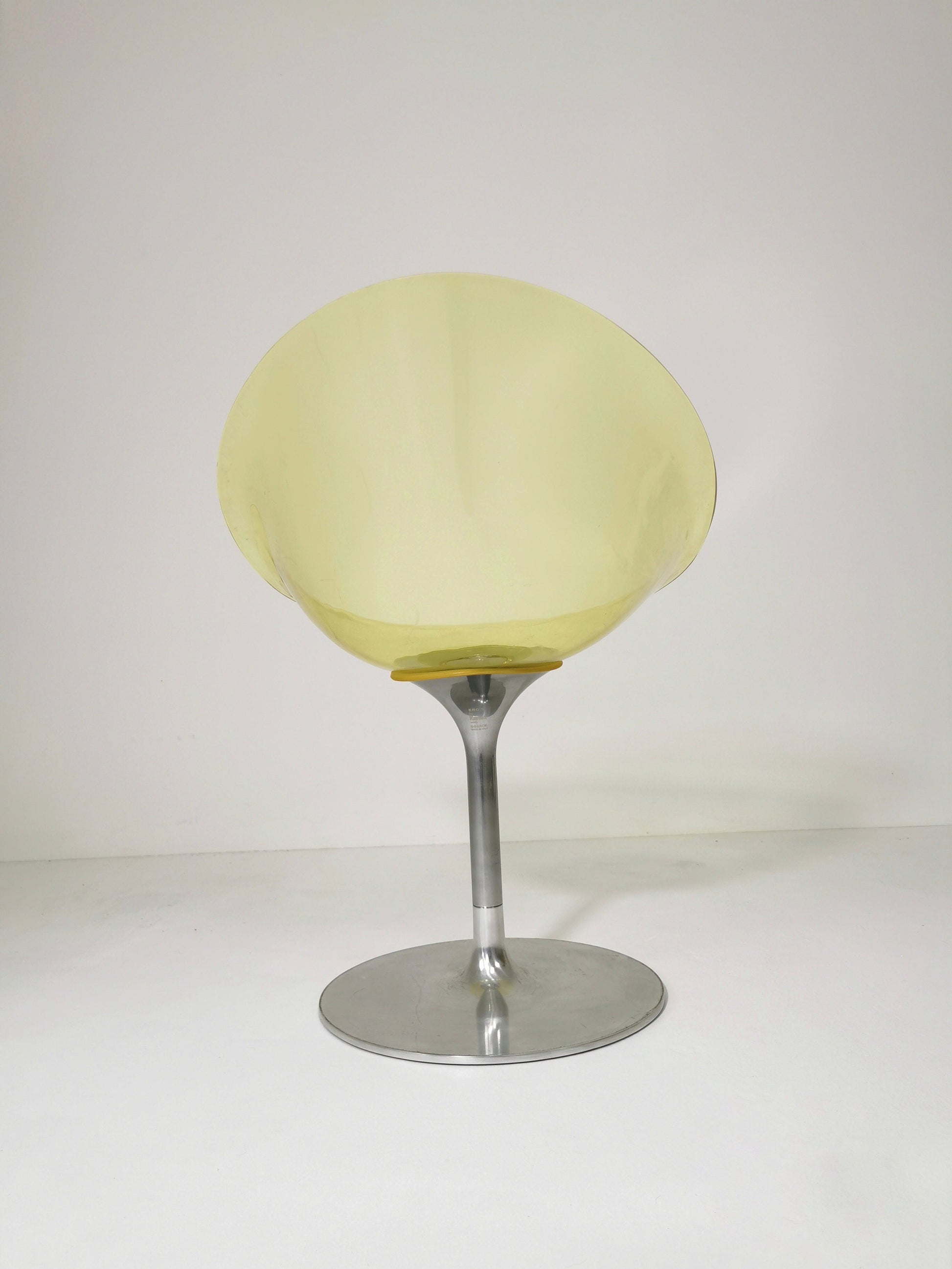 yellow Eros chair with aluminum swivel base by Philippe Starck for Kartell. Italy.