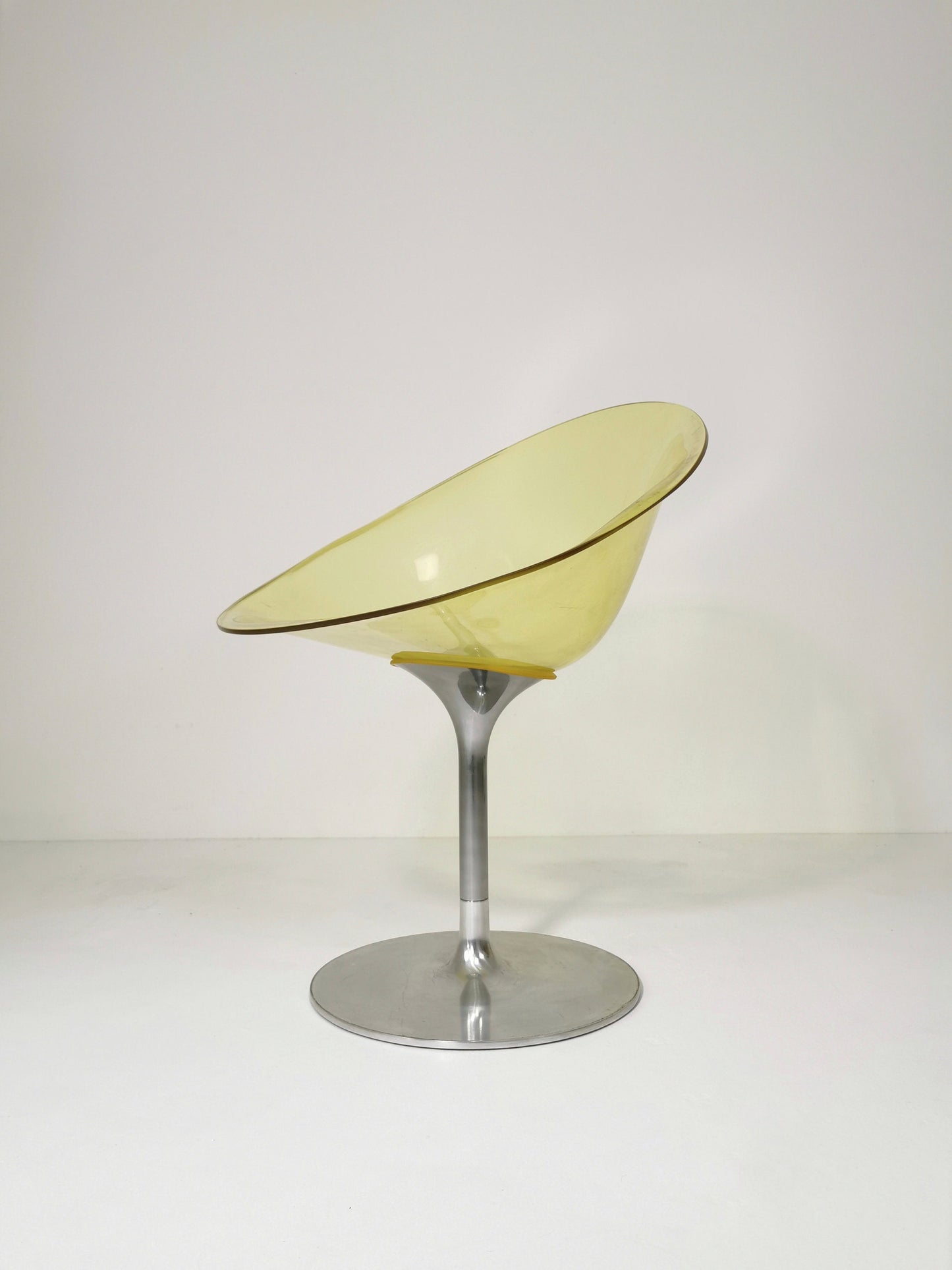yellow Eros chair with aluminum swivel base by Philippe Starck for Kartell. Italy.