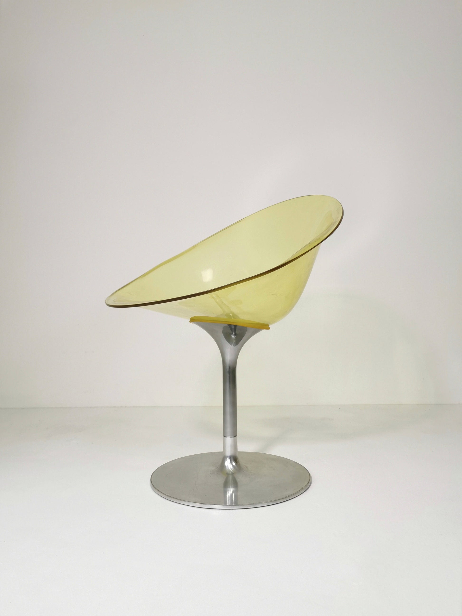 yellow Eros chair with aluminum swivel base by Philippe Starck for Kartell. Italy.