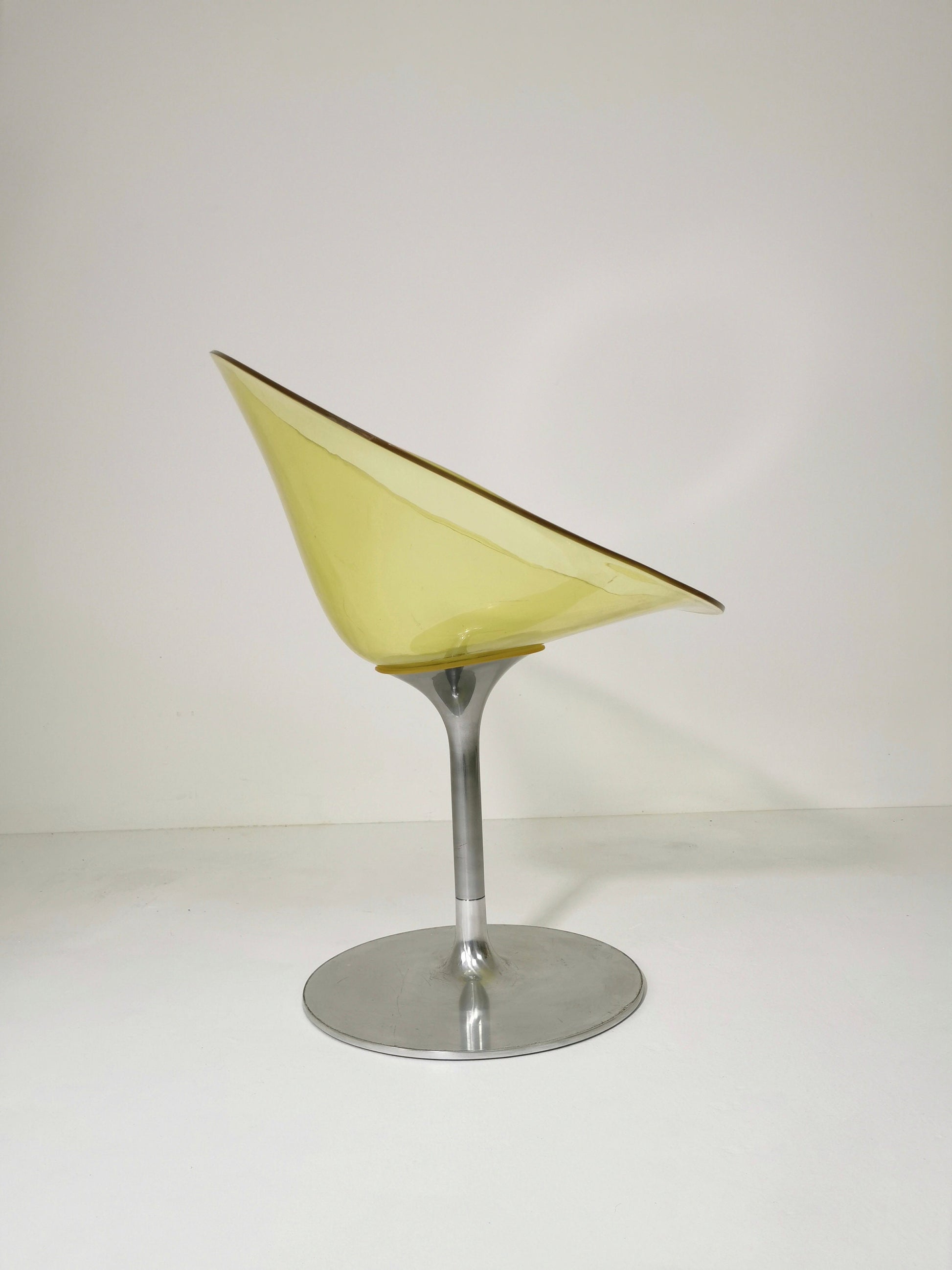 yellow Eros chair with aluminum swivel base by Philippe Starck for Kartell. Italy.