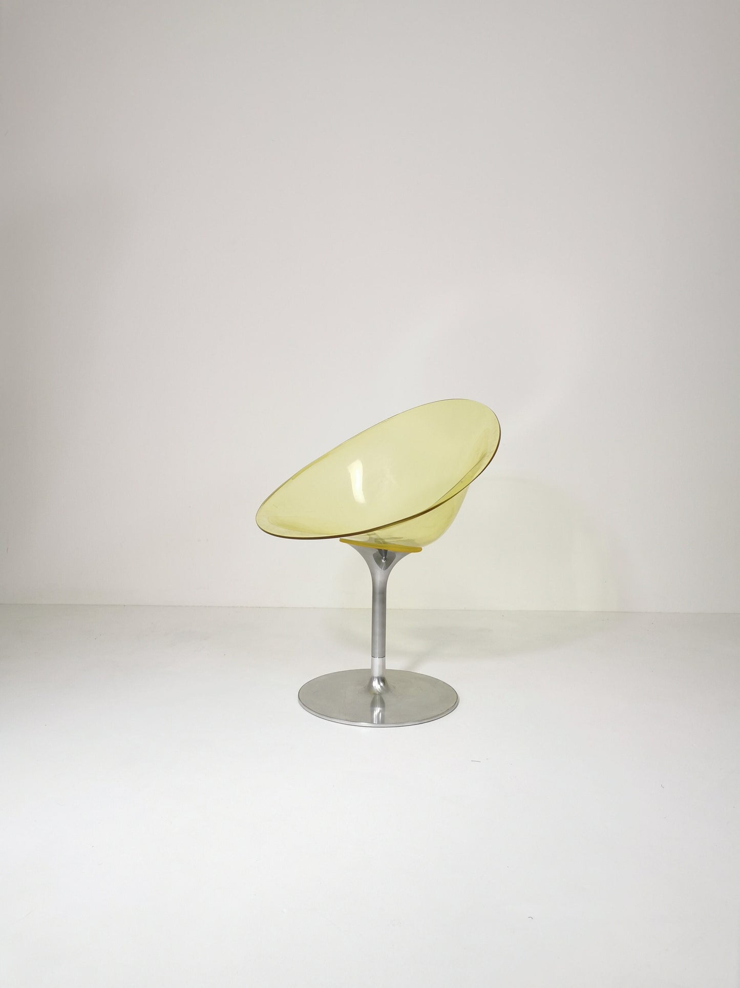 yellow Eros chair with aluminum swivel base by Philippe Starck for Kartell. Italy.