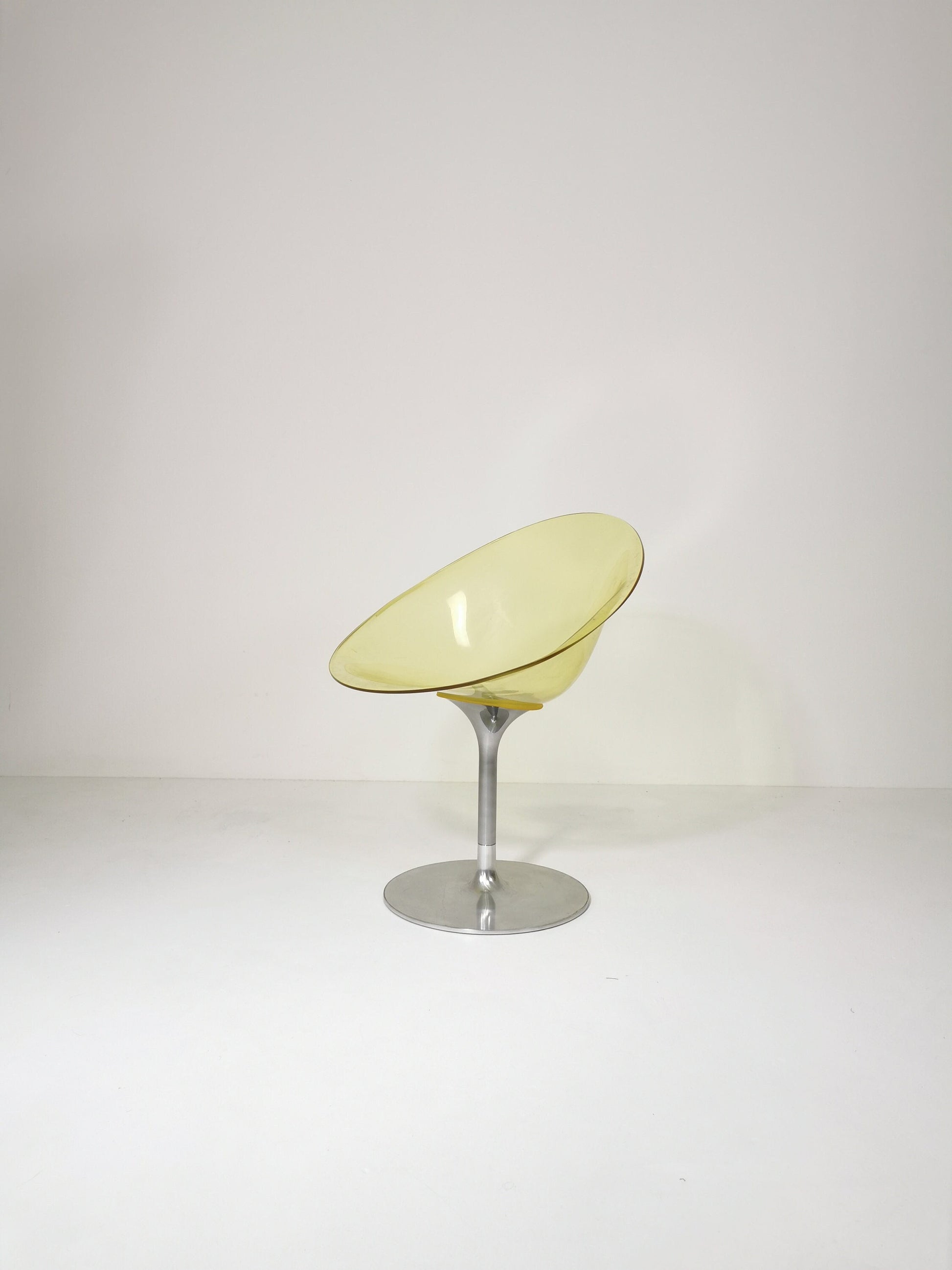 yellow Eros chair with aluminum swivel base by Philippe Starck for Kartell. Italy.
