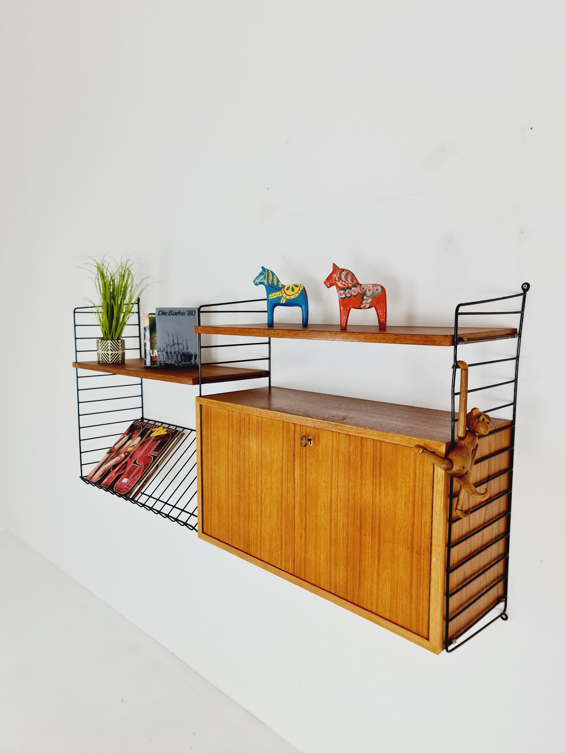 Wall-mounted original Swedish string shelf-system, bookcase cabinet teak by Nils & Kajsa Strinning, 1960s