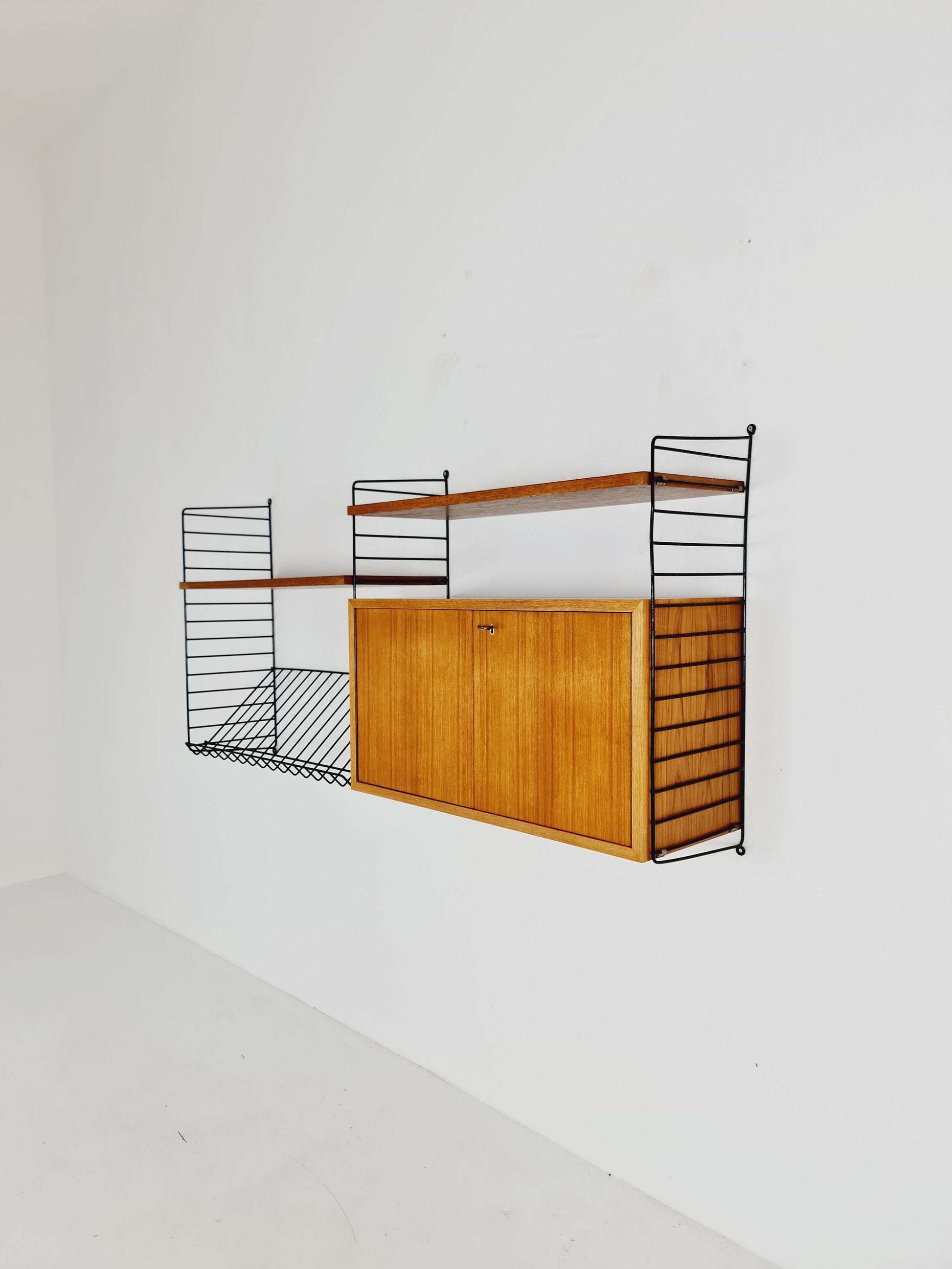 Wall-mounted original Swedish string shelf-system, bookcase cabinet teak by Nils & Kajsa Strinning, 1960s
