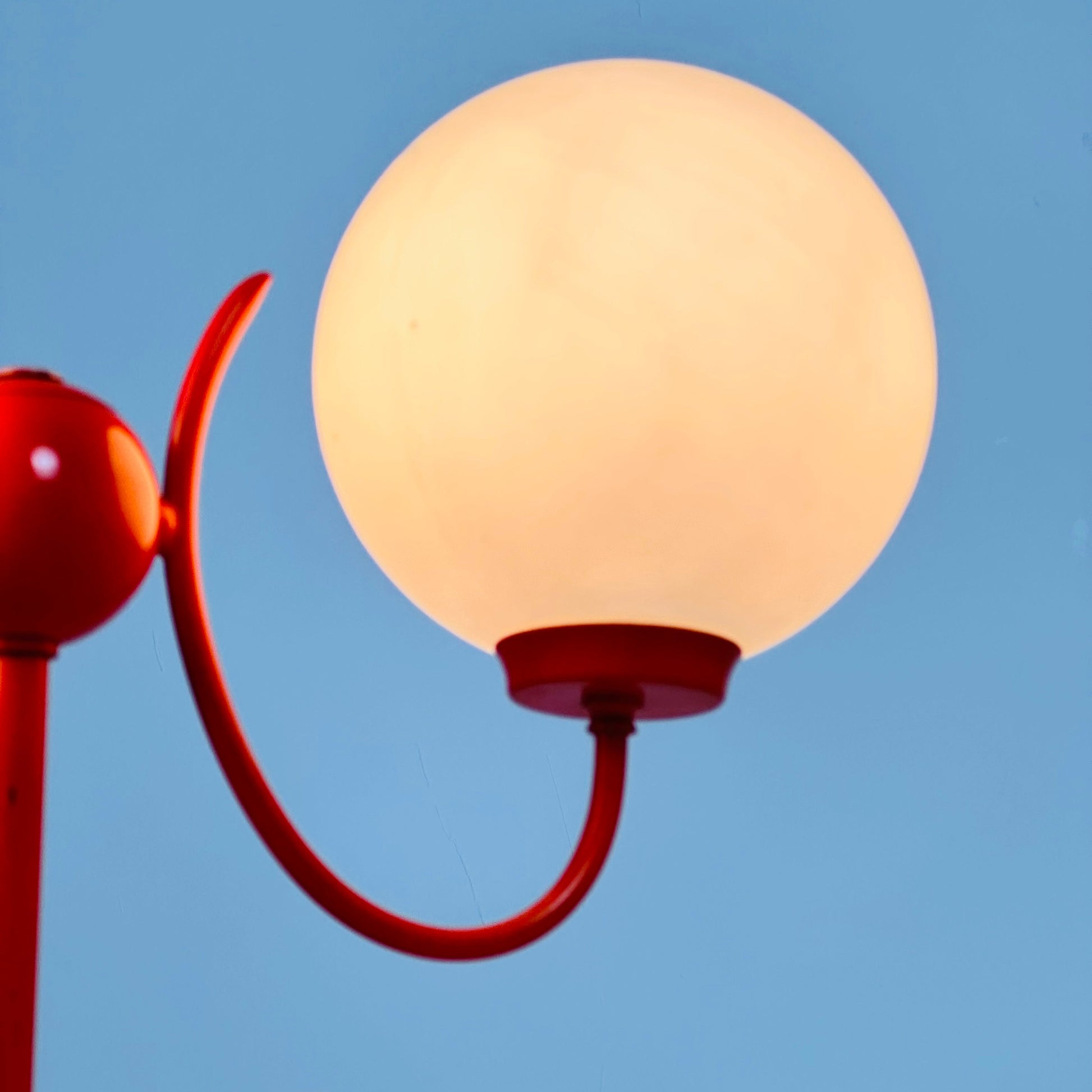 Opaline glass, orange tulip shaped base makes this stunning space age mid century table lamp . Made by Kaiser Leuchten, Germany 1970s