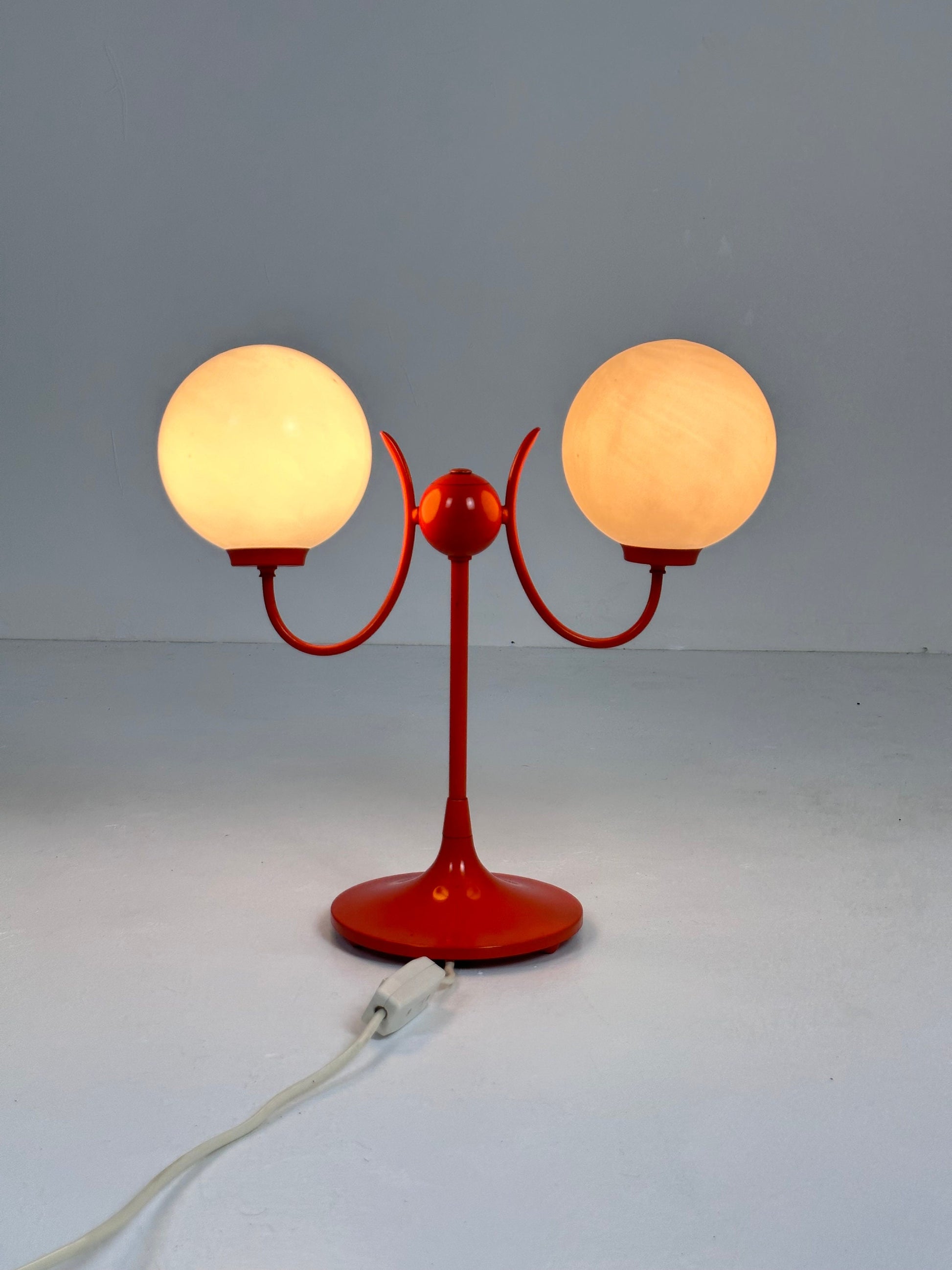 Opaline glass, orange tulip shaped base makes this stunning space age mid century table lamp . Made by Kaiser Leuchten, Germany 1970s