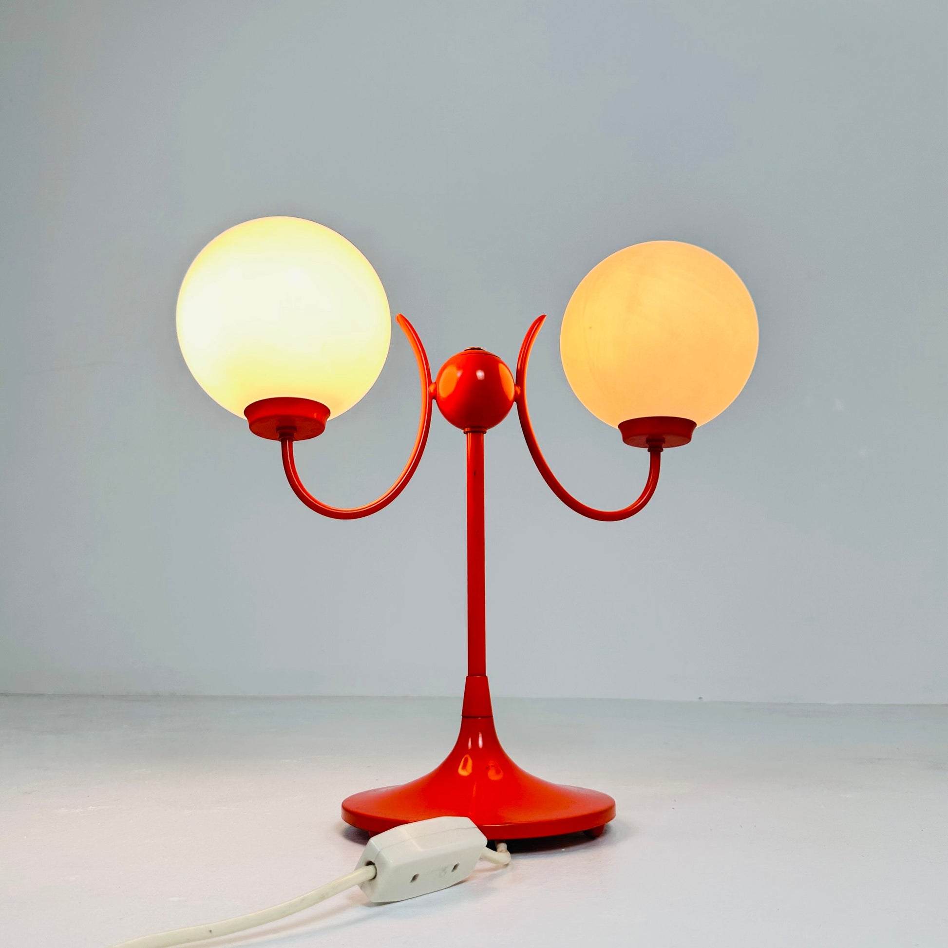 Opaline glass, orange tulip shaped base makes this stunning space age mid century table lamp . Made by Kaiser Leuchten, Germany 1970s