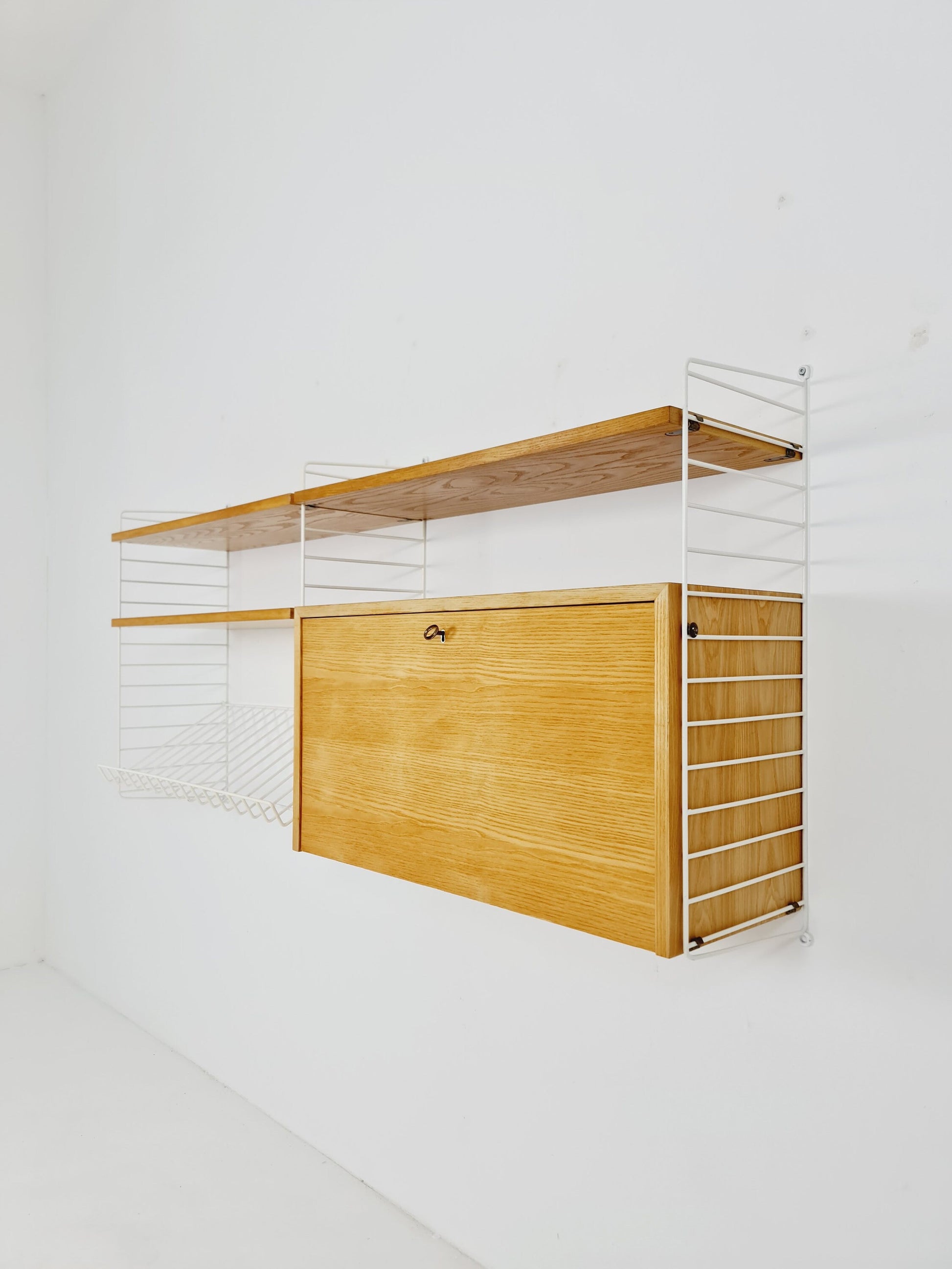 Wall-mounted original Swedish string shelf-system, bookcase cabinet Oak by Nils & Kajsa Strinning, 1960s