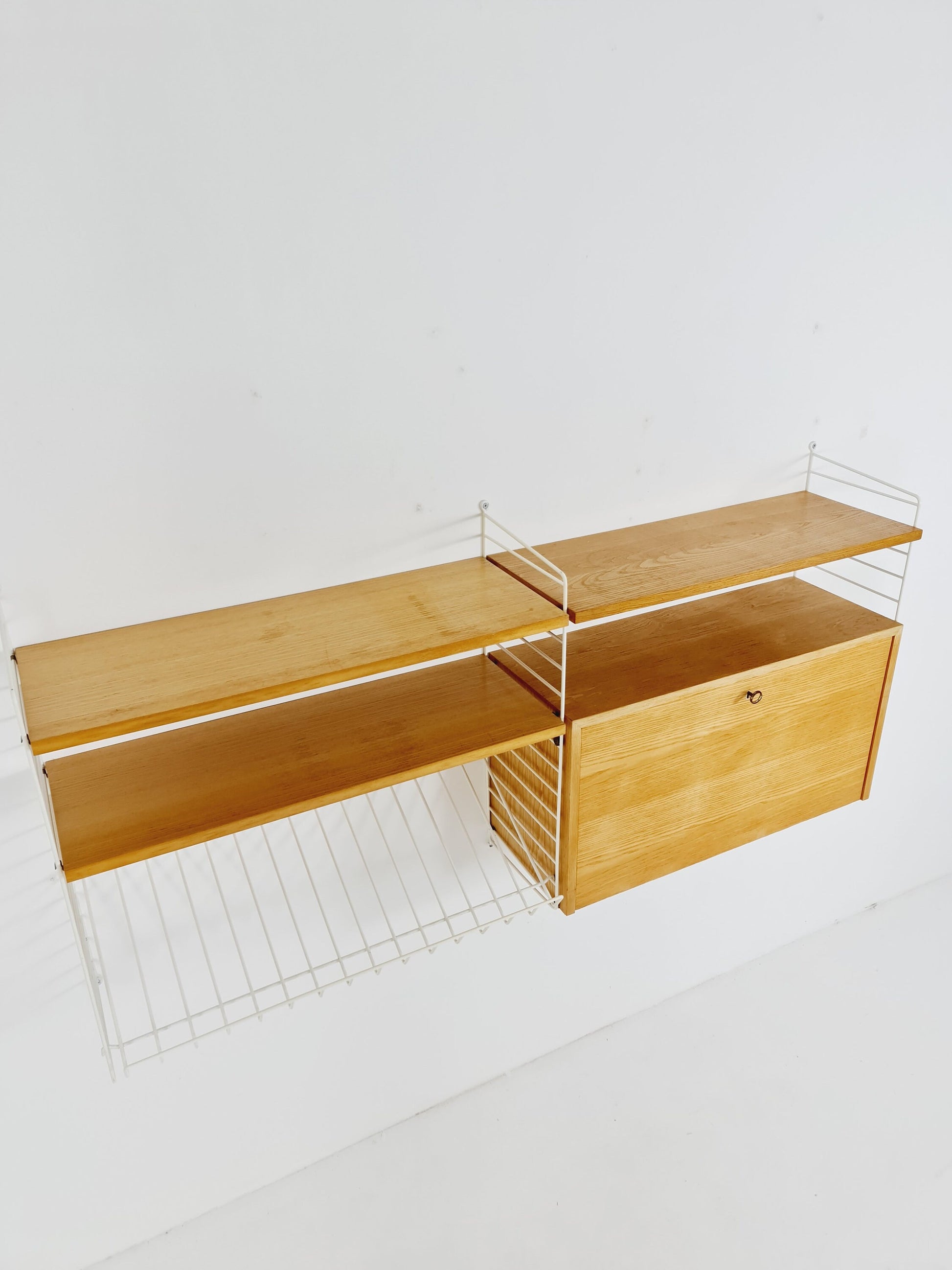 Wall-mounted original Swedish string shelf-system, bookcase cabinet Oak by Nils & Kajsa Strinning, 1960s