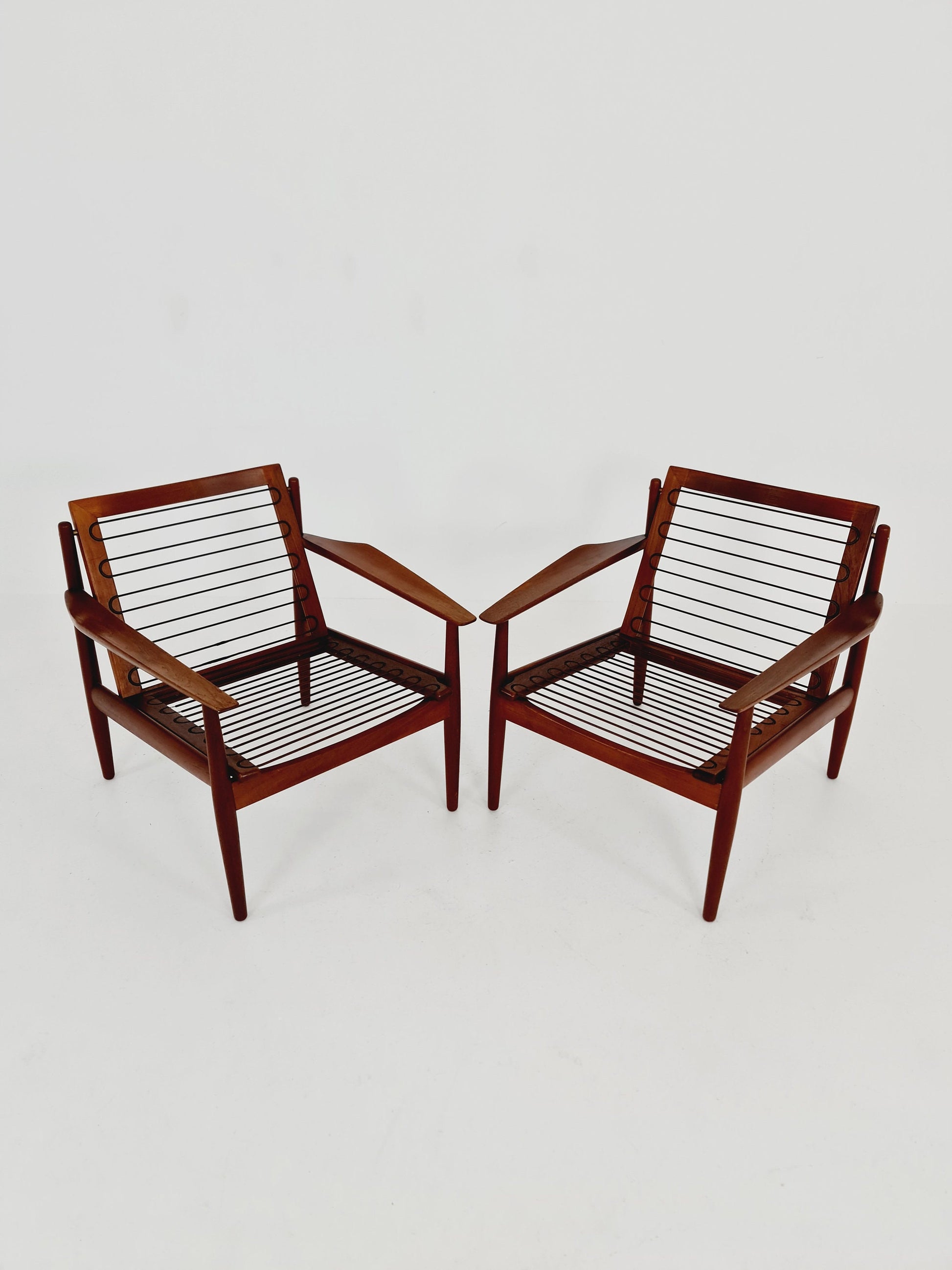 Mid century easy lounge chairs by Grete Jalk, Denmark, teak & brass, 19560s, Set of 2