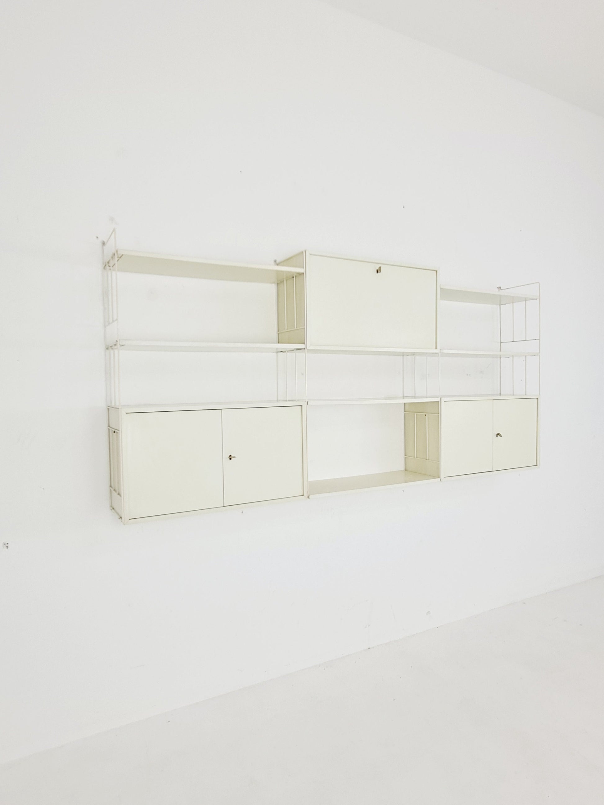 Wall-hanging String shelf-system, bookcase with bar cabinetby WHB Germany, 1950s