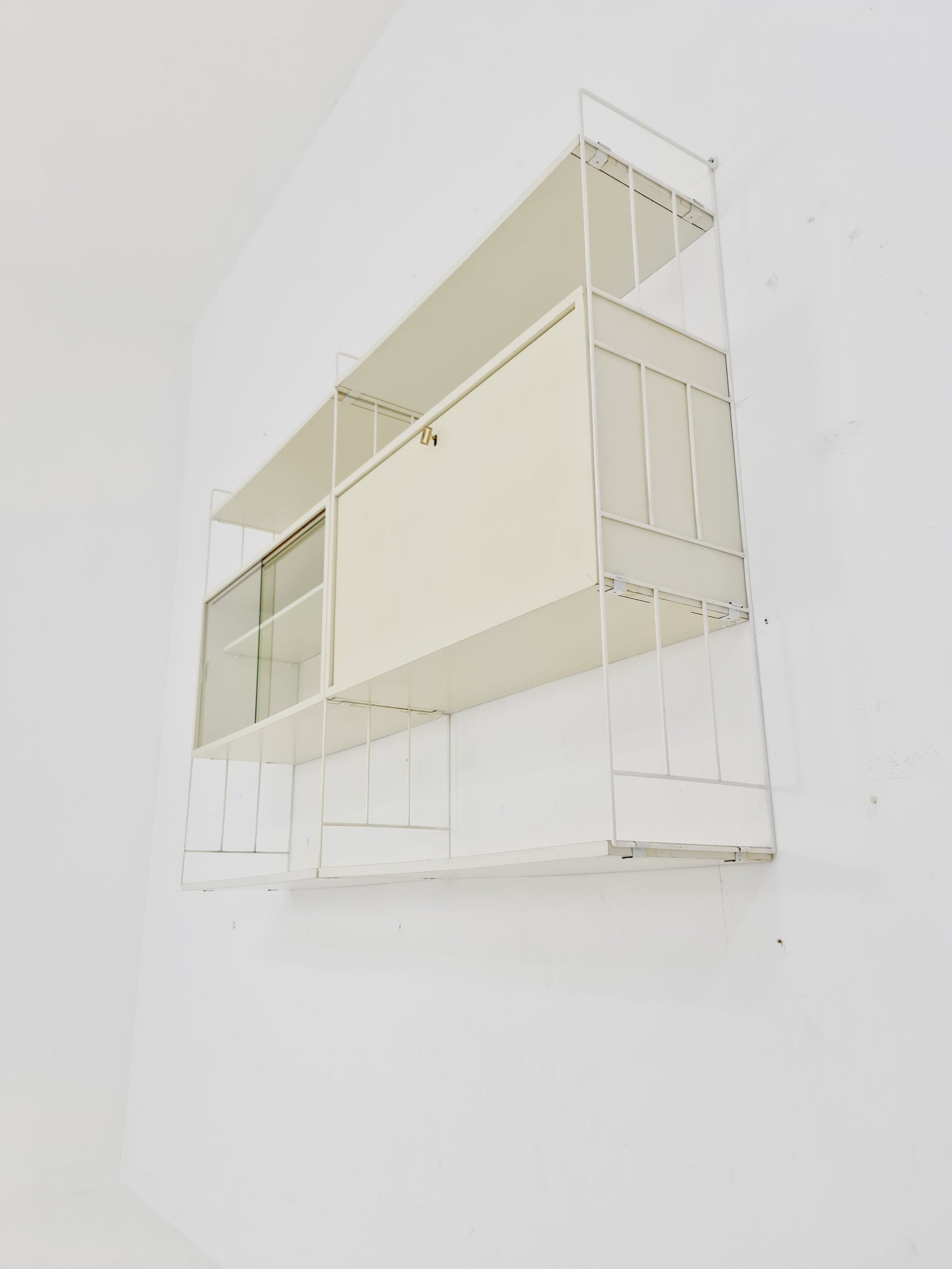 Wall-hanging String shelf-system, bookcase with bar cabinet by WHB Germany, 1950s