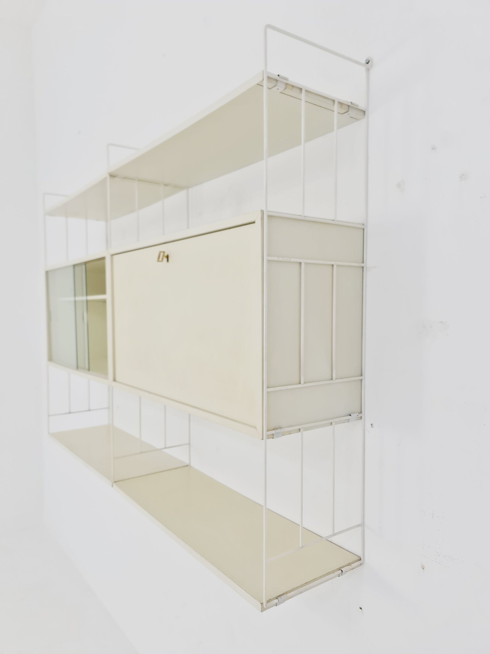 Wall-hanging String shelf-system, bookcase with bar cabinet by WHB Germany, 1950s