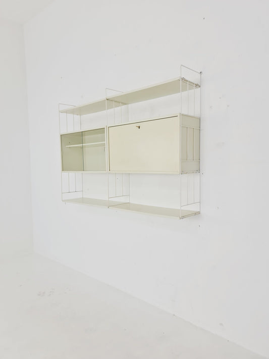 Wall-hanging String shelf-system, bookcase with bar cabinet by WHB Germany, 1950s
