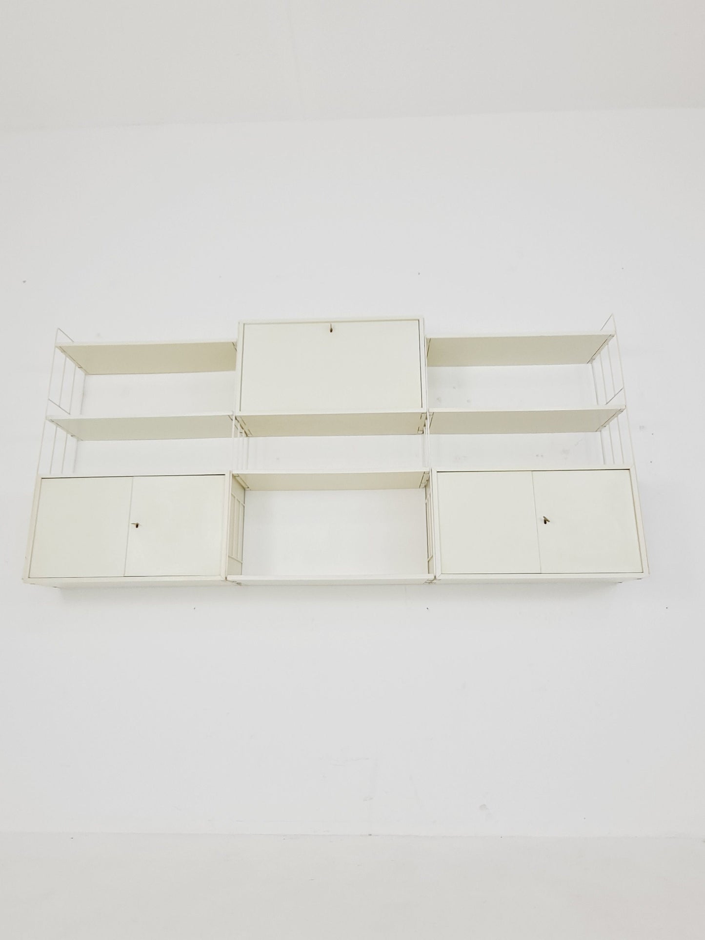 Wall-hanging String shelf-system, bookcase with bar cabinetby WHB Germany, 1950s