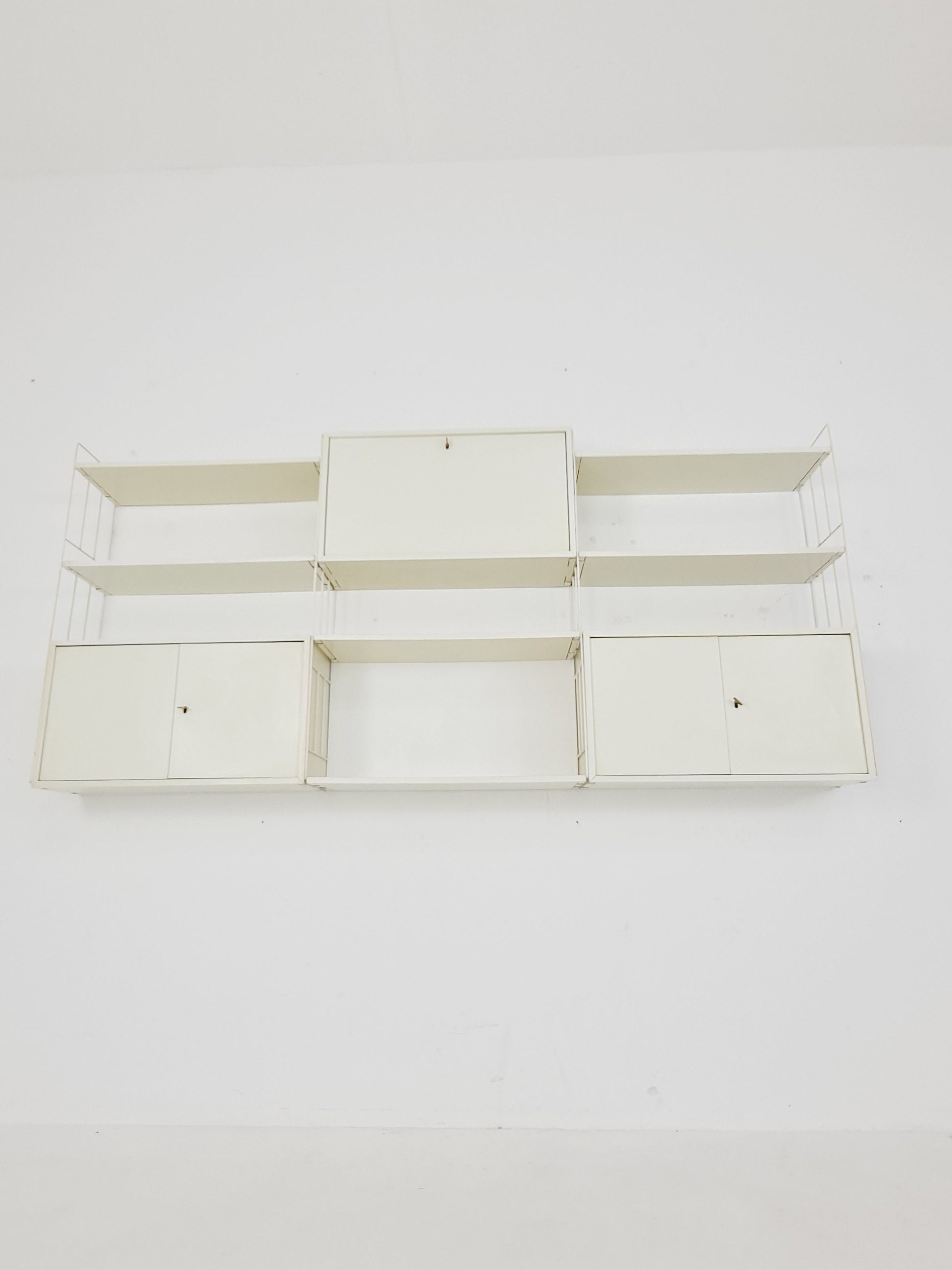 Wall-hanging String shelf-system, bookcase with bar cabinetby WHB Germany, 1950s
