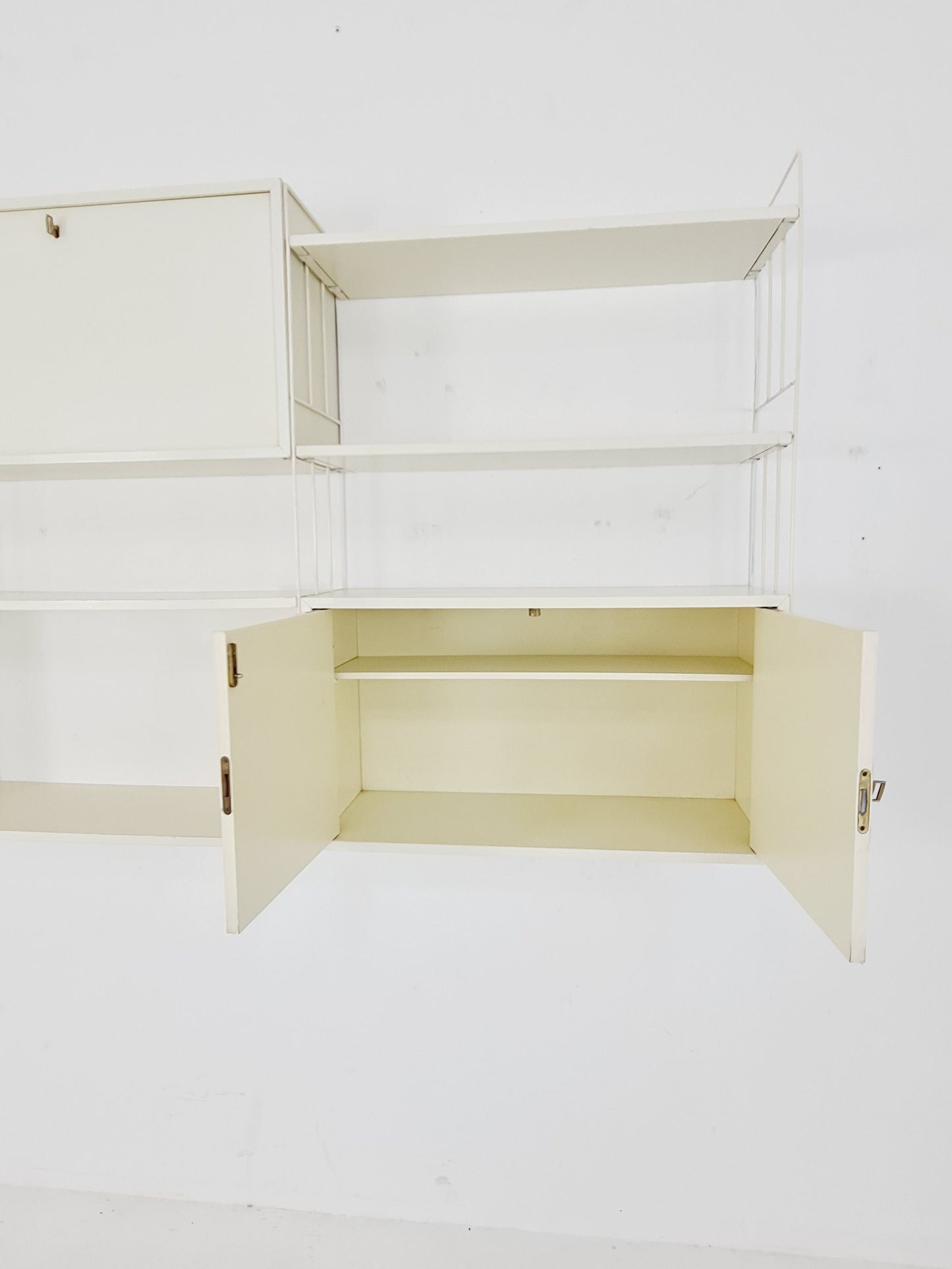 Wall-hanging String shelf-system, bookcase with bar cabinetby WHB Germany, 1950s